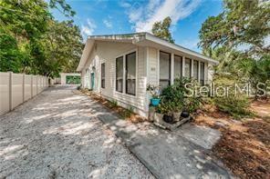 Fully furnished downtown Dunedin Bungalow with a newly finished detached garage that has been converted to a game room and entertainment area. Located in a quiet residential neighborhood 2 blocks from the Pinellas Trail and a quick walk to the many restaurants, bars and shops in downtown with easy access to the Dunedin Marina, Dunedin Causeway, Toronto Blue Jays baseball stadium, Honeymoon and Caladesi Island State Parks. Lots of charm and comfort in this adorable home that features a wood burning fireplace, pine floors, a freestanding clawfoot bathtub, an updated kitchen, inside laundry room and large screened in patio. Low maintenance landscaping with plenty of parking and privacy. Dog friendly and ready for a renter looking for a prime Dunedin location.