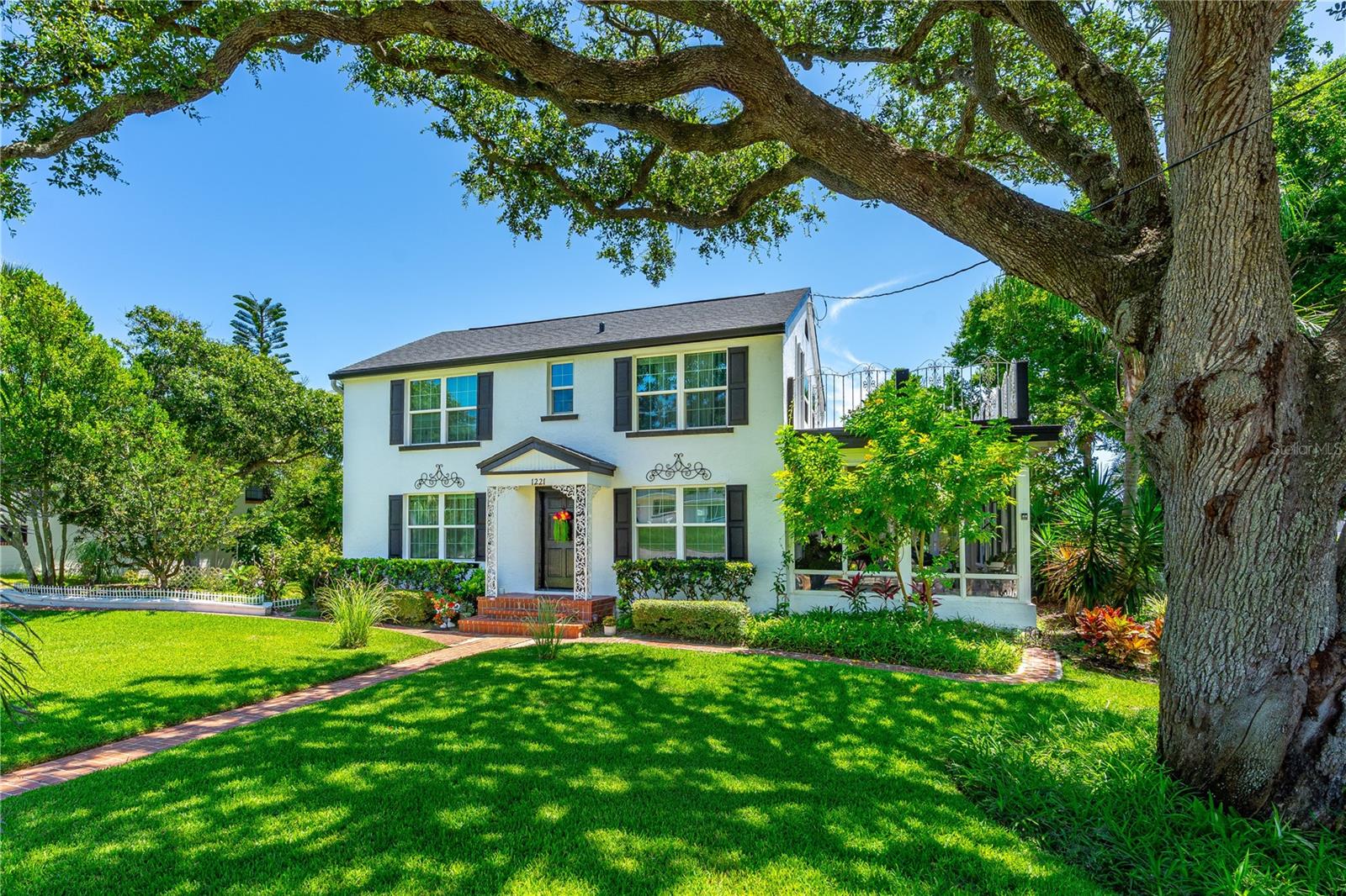 Just steps from the World's Most Famous Beach, this beautifully updated historic home is nestled in the sought-after Bostwick Park, one of the most desirable and picturesque neighborhoods along the coast. Nearly everything has been tastefully renovated while preserving the home's original charm and architectural character. This one-of-a-kind property is a rare gem in our area, offering a unique blend of history, beauty, and location. Situated on a rare double lot, it features lush landscaping, an oversized detached 2-car garage, and multiple outdoor living spaces. Enjoy a spacious covered patio off the living room and a private sundeck off the upstairs primary suite. Inside, you'll find a bright, airy layout with gorgeous refinished hardwood floors and thoughtful finishes throughout. Full list of recent upgrades available upon request. This is coastal living at its finest!