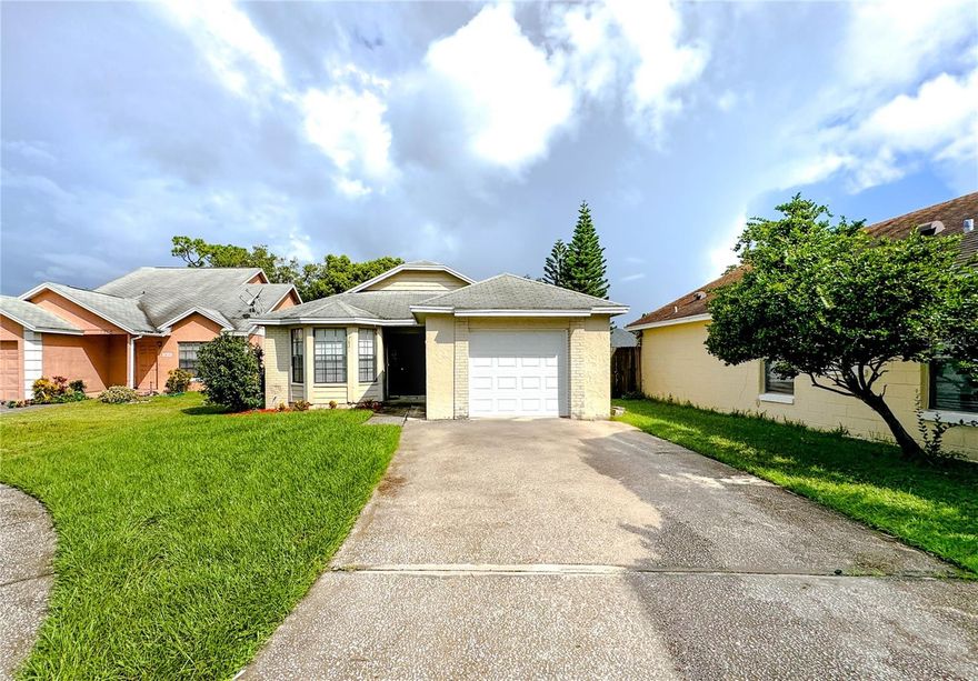 BRAND NEW ROOF just installed April 2026! Come check out this great 3 bedroom, 2 bathroom starter home in the beautiful Devonwood Community just outside of Downtown Orlando! Step inside to plenty of natural lighting in this airy home with warm and inviting interior colors! Enjoy features such as a walk-in closet and double sink vanity in the master suite, covered & open back patio perfect for relaxing on after a long day, privacy fenced yard, garage, and more! Convenient to tons of shopping/food nearby including Walmart, Sam's Club, Publix, International World Market, and more! Access to major roads such as St Rd 50, 408, and 417!