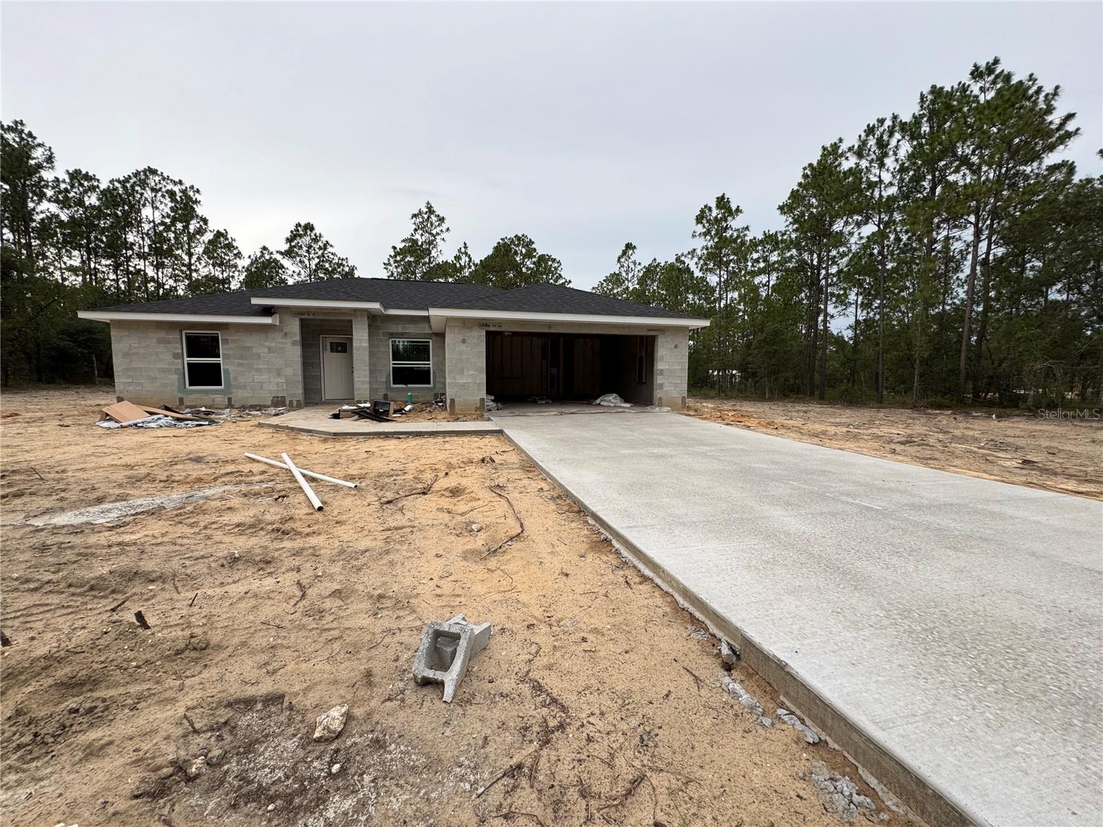 Under Construction. Beautiful new 3-bedroom 2-bathroom 2 car garage Home Block and Stucco finish. Many upgrades including stone countertops, Porcelain Tile Flooring throughout, ceiling fans, soft close cabinetry, Stainless steel appliance package includes: Refrigerator, Range, Dishwasher and Microwave. Versatile kitchen island. The primary bathroom offers a double sink vanity, Walk-in closet, Walk-in shower and tub. No Homeowner’s Association, No Deed Restrictions. Conveniently located. If you are ready to move…This is the one.