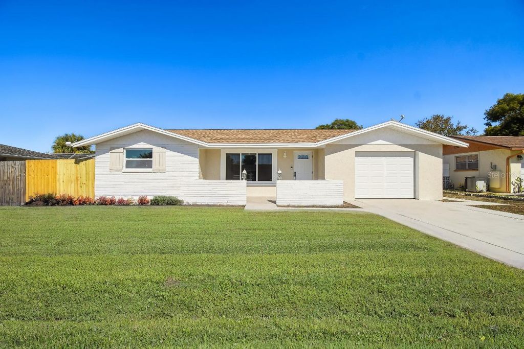Photo of 7631 Briarwood Drive, Port Richey, FL 34668 (MLS # TB8448921)