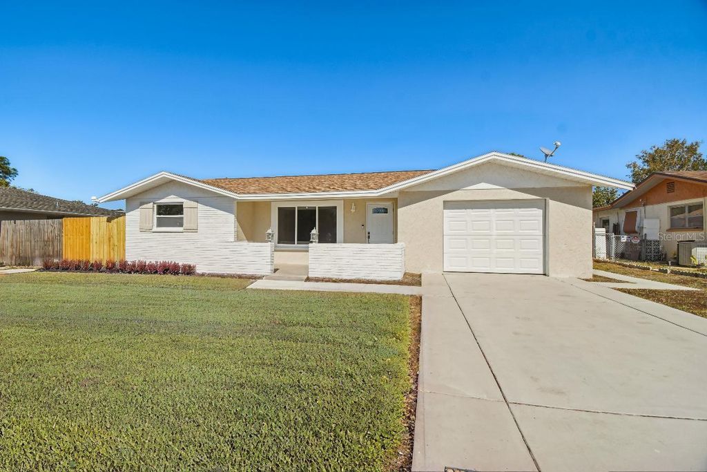 Photo of 7631 Briarwood Drive, Port Richey, FL 34668 (MLS # TB8448921)