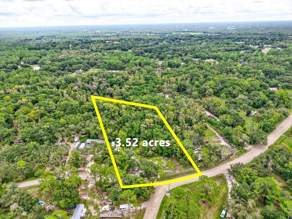 Discover the perfect blend of country living and convenience with this 3.52-acre vacant lot in the sought-after Ranchland Acres community. This expansive parcel offers plenty of space to design your dream home, add outbuildings, or create the private retreat you’ve always envisioned. With its generous size, you’ll have room for horses, gardens, or simply the peace and quiet of wide-open land. Ranchland Acres is known for its spacious lots, rural charm, and proximity to everyday necessities. Here, you’ll enjoy a tranquil lifestyle while still being just a short drive from shopping, dining, schools, and major highways. Outdoor enthusiasts will appreciate being near Florida’s natural springs, lakes, and state parks, offering endless opportunities for boating, fishing, hiking, and exploring. Whether you’re looking to build now or secure land for the future, this property provides the perfect opportunity to own a piece of Florida’s countryside in a growing area. No HOA and plenty of flexibility make this lot a rare find. Call for more details today!!!