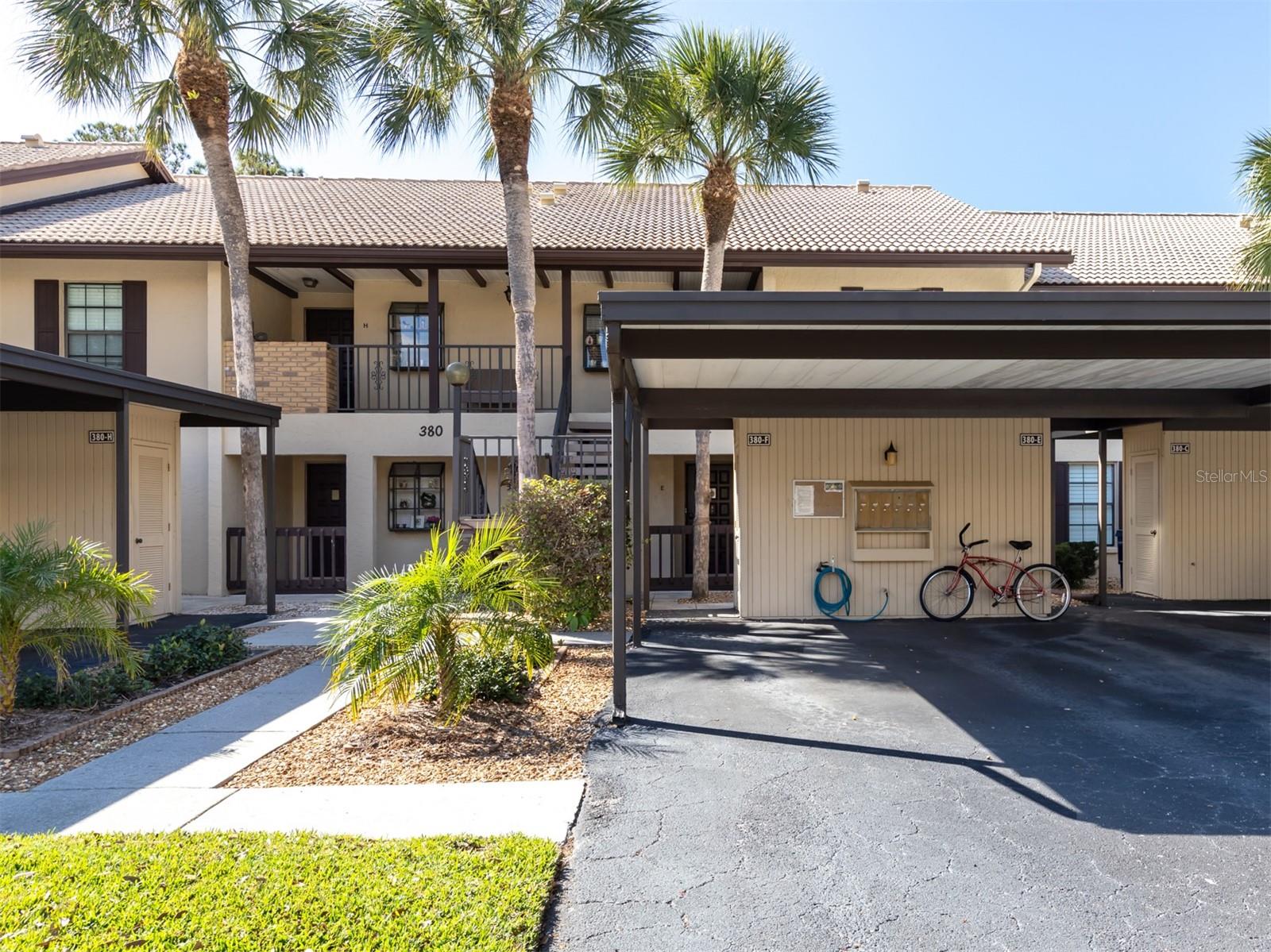 Welcome to Mission Lakes! Lovely updated upper unit overlooking the water being sold turnkey furnished. With gorgeous views of one of the community lakes from your screened balcony, this condominium is a must-see. Welcome to a clean home with an open floor plan that has been thoughtfully renovated and updated. Updated AC unit in 2020, new interior, stacked washer and dryer in 2020 and water heater in 2019. The kitchen update features new cabinetry and granite countertops with a spacious eat-in breakfast bar addition. The kitchen is open to the dinette space and living room creating an open and airy space. The living room boasts a new bar area with a stainless steel wine chiller and beautiful built-in cabinets and granite countertop ideal for entertaining. The primary bedroom offers access to the lanai and features a large walk-in closet and en-suite bath. The in-unit full-size washer and dryer will be greatly appreciated. The split floor plan allows guests their own space with access to a second bath with updated vanity. Two cars are allowed while parked tandem in the designated covered parking space complete with additional exterior storage for bikes and beach toys. Mission Lakes is a quaint community consisting of 265 units among three lakes, one of which features a day dock that residents can enjoy. Residents have the use of three separate heated swimming pools. Quarterly maintenance fees include cable TV, water, trash and recycling collection. Ideally near the Island of Venice, Mission Lakes is near shopping, upscale dining, arts and beaches, as well as the downtown Venice area which serves as the venue for community festivals, parades and activities. Mission Lakes is a pet-free community.
