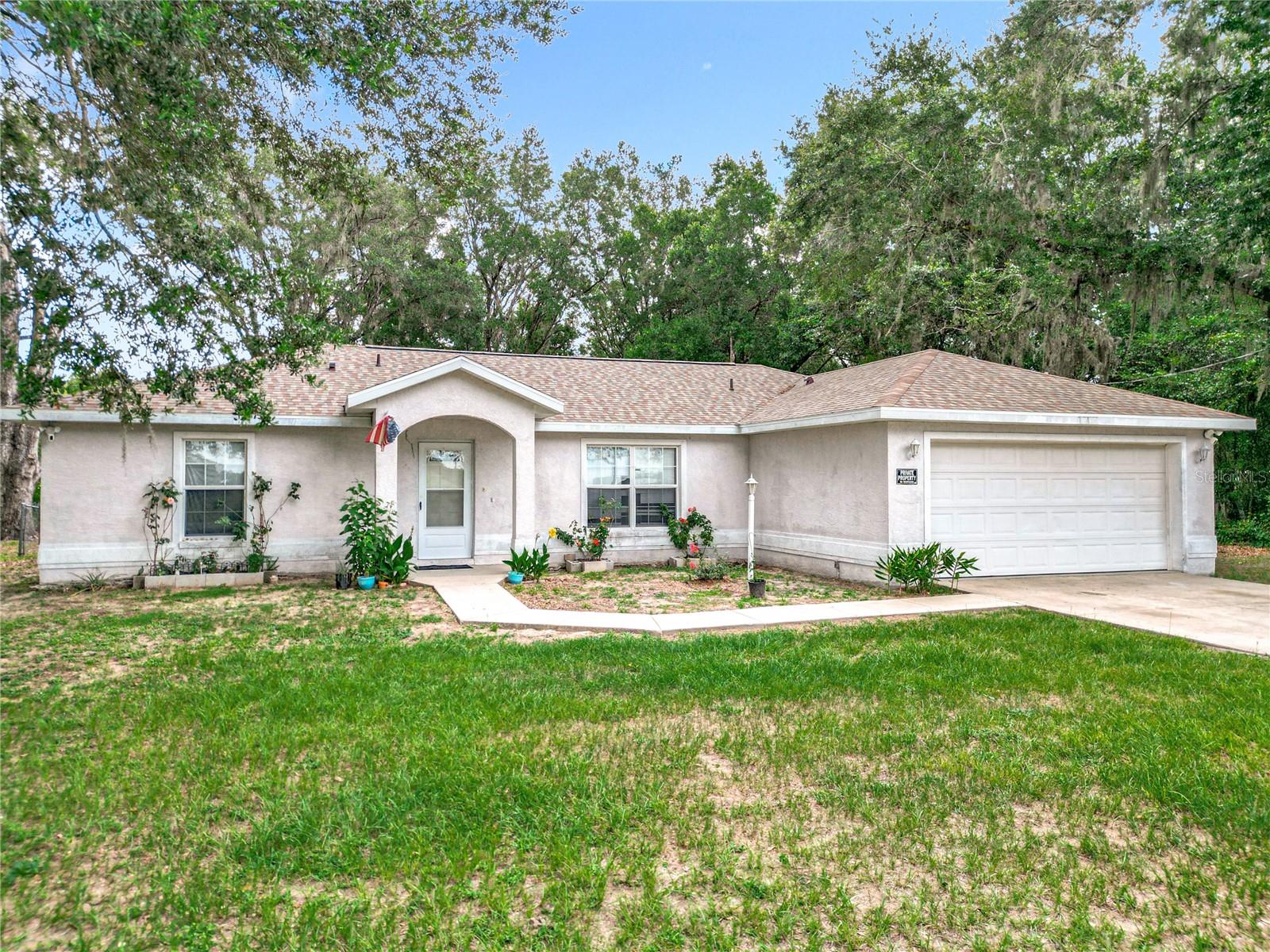 Come see this 3 bedroom, 2 bath home with 2-car garage featuring tile flooring throughout main areas and carpet in the bedrooms. Cathedral ceilings add an open feel to the living space. Enjoy the convenience of an indoor laundry room and a screened-in porch overlooking a fully fenced yard—ideal for relaxing or entertaining. Major updates include a new roof (2024) and A/C (2023). Located near the World Equestrian Center, hospitals, and major highways for easy access to everything.