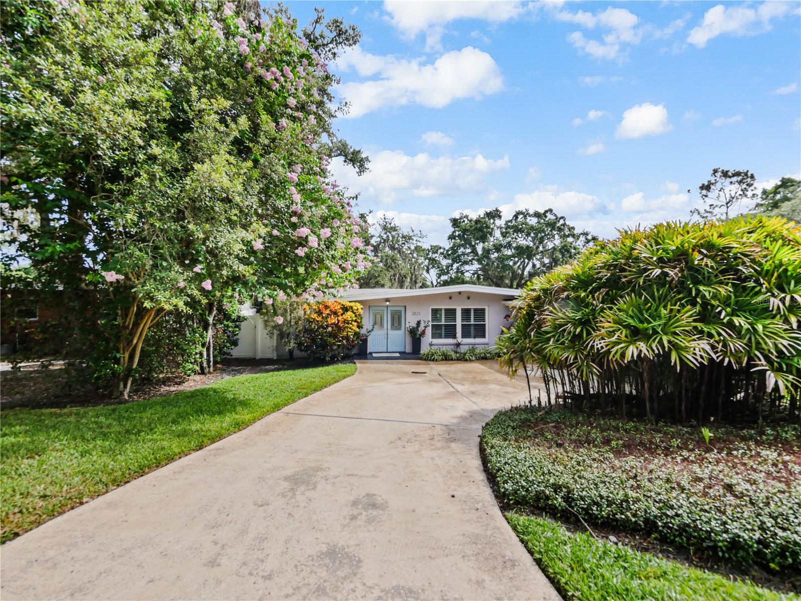 Here’s your chance to own something truly special in Winter Park! This gorgeous lakefront home sits on over HALF AN ACRE, a rare find in this area - allowing opportunity to BUILD YOUR DREAM HOME! Step inside to find a thoughtfully updated kitchen featuring high-end appliances, custom cabinetry, and designer finishes, ideal for both entertaining and everyday living. The home boasts new windows that fill the space with natural light and frame serene lake views, as well as a brand new roof and AC offering peace of mind for years to come. Split floor plan with 3 large bedrooms and each has a walk-in closet. Step outside and take in the beautifully landscaped yard, complete with mature trees and plenty of space and privacy. Whether you’re sipping coffee by the water or hosting friends for a sunset BBQ, this home is made for living the good life. Zoned for A rated schools. Tucked away on a quiet street but still close to everything in Winter Park, this one checks all the boxes!