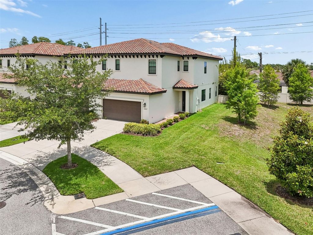 Photo of 13047 Sanctuary Village Lane, Tampa, FL 33624 (MLS # TB8510538)