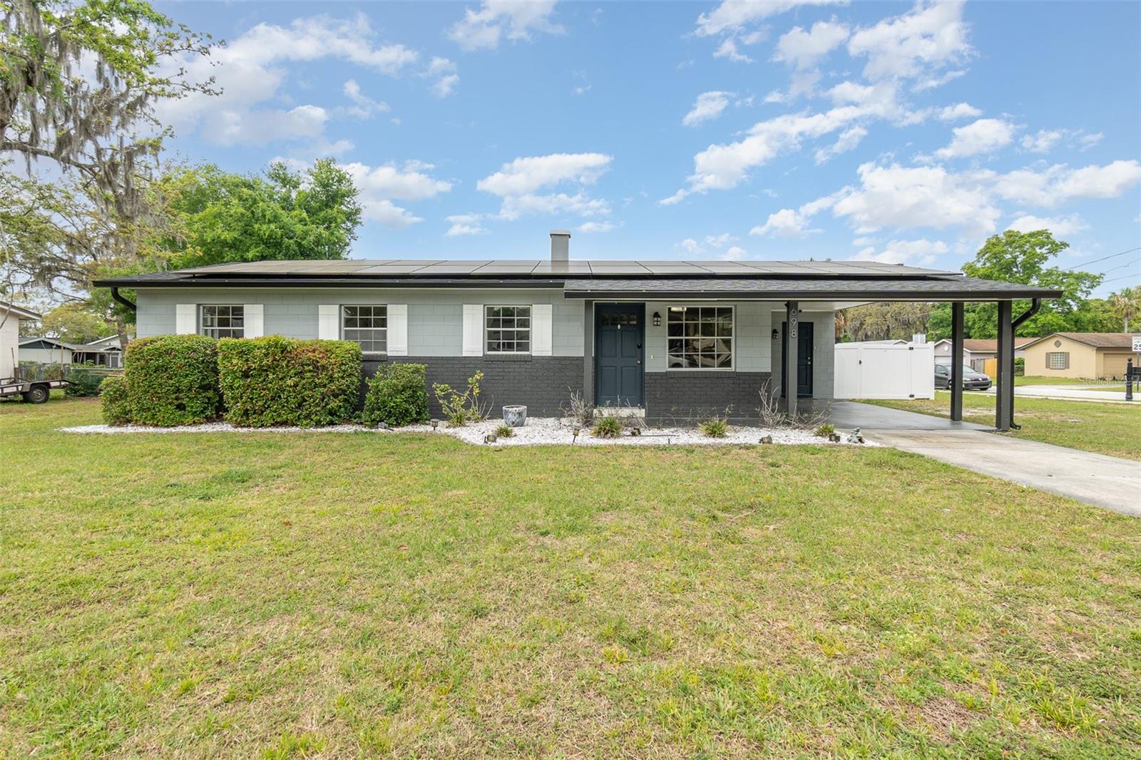 Updated 3-Bedroom Home with Solar and Prime Location! Discover this beautifully maintained 3-bedroom, 2-bathroom single-family home situated on an oversized ¼-acre corner lot in the heart of Altamonte Springs! Step inside to find both bathrooms recently remodeled, including a fully updated primary bath with a sleek glass shower door, modern cabinetry, updated fixtures, and stylish mirrors. The kitchen shines with granite countertops and stainless steel appliances, making meal prep a joy. Enjoy the added value of fresh interior paint, new carpeting in all bedrooms, a vinyl-fenced backyard, and a large storage shed for all your tools and toys. Major systems—including the roof, A/C, water heater, and electrical panel—were updated in 2018, offering lasting peace of mind. Energy-efficient solar panels help reduce monthly electric bills and can either be assumed or paid in full at closing with a full-price offer—a major bonus for long-term savings! Perfectly located near Sanlando Park, Cranes Roost Park, Altamonte Mall, and a variety of shopping and dining options. Whether you're commuting or just enjoying local conveniences, this location can’t be beat! Don’t miss your chance to own a move-in ready home with modern upgrades, energy savings, and an unbeatable Altamonte Springs location!