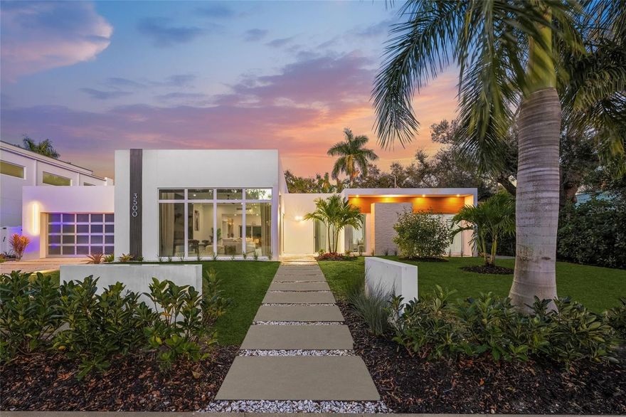 Experience Elevated Sarasota Living at 3500 Bay Shore Road This newly reimagined coastal contemporary residence embodies modern luxury
and effortless sophistication. Completely redesigned and renovated in June 2025, this home feels brand-new from top to bottom. Every element was carefully curated for comfort, beauty, and functionality—offering the ideal balance between serene retreat and entertainer’s paradise. Step inside to discover a light-filled, open layout featuring soaring ceilings, expansive windows, and a striking 12-foot custom fireplace wall that creates an inviting focal point. The chef’s kitchen is a showpiece, boasting imported European white oak cabinetry, Taj Mahal quartzite countertops, and brand-new premium appliances—perfect for cooking or hosting with style. The primary suite serves as a private sanctuary with direct access to the pool terrace, custom closets, and a spa-inspired bathroom with designer finishes. Additional highlights include a central vacuum system, hurricane-impact windows, Tesla charging station, and an advanced Puronics reverse-osmosis water system delivering pristine alkaline drinking water throughout the home. Outdoors, enjoy a private oasis surrounded by lush tropical landscaping. The lap pool, cabana, and ample lounging space create the ultimate resort-style atmosphere for relaxing or entertaining. Perfectly situated minutes from downtown Sarasota, residents will love easy access to Lido Key and Siesta Key beaches, St. Armands Circle, fine dining, luxury shopping, and cultural landmarks like the Ringling Museum and Sarasota Opera House. Offered fully furnished, this exceptional home combines the best of modern design, location, and lifestyle—making it a rare opportunity to lease a piece of Sarasota’s finest coastal living.