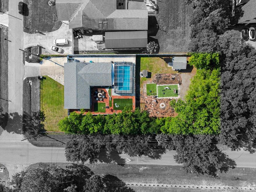 Welcome to this well-maintained single-family home featuring a private pool, ideally situated on an oversized corner lot and constructed with solid block. This property offers 4 bedrooms and 3 full bathrooms on a spacious nearly half-acre lot (0.43 acres), zoned RSC-6, in the highly desirable Town & Country area of Tampa. With no HOA, this move-in ready home provides flexibility, functionality, and excellent long-term potential.

The home features a wide frontage with ample parking for multiple vehicles. Upon entry, you are welcomed into a comfortable living room that flows into the dining area. To the left, you’ll find the laundry room, while to the right, the open-concept kitchen offers granite countertops, a modern backsplash, and abundant natural light.

A hallway leads to three bedrooms and two bathrooms, including the primary suite, which features a private bathroom and walk-in closet. The property also includes an additional flexible living space complete with its own bathroom and kitchenette—ideal for guests, extended family, or potential in-law use (buyer to verify).

Before accessing the outdoor area, there is a versatile space perfect for a family room or entertainment area, leading to a covered patio and a spacious screened-in pool—ideal for enjoying Florida’s year-round outdoor living. The backyard also features additional open space with room for future improvements or expansion.

Conveniently located with easy access to the Veterans Expressway, Hillsborough Avenue, and the Courtney Campbell Causeway, and just minutes from Tampa International Airport. Enjoy close proximity to International Plaza, Westshore Business District, Downtown Tampa, Clearwater Beach, St. Pete Beach, Raymond James Stadium, Amalie Arena, Busch Gardens, and the Tampa Riverwalk.

Opportunities like this—featuring lot size, location, and overall potential—are increasingly rare in this area.

Buyer and buyer’s agent are advised to verify all zoning regulations, land use restrictions, and any county requirements regarding future construction or improvements, including the use of the rear portion of the property.

Schedule your private showing today.