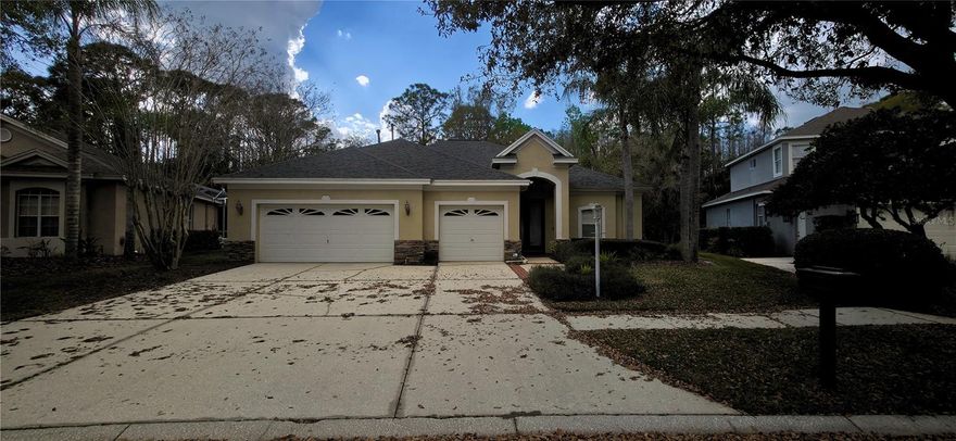 Discover this stunning contemporary home in the Tampa Palms community. This spacious 4-bedroom, 3-bathroom residence, with a bonus room, sits on a serene conservation lot, offering privacy and natural beauty. Featuring soaring ceilings, crown moldings, hardwood floors, and diagonal ceramic tile, every detail exudes elegance.
The gourmet kitchen boasts wood cabinetry, Corian countertops, and stainless steel appliances. The family room opens to a brick-paved patio with breathtaking conservation views. A massive bonus room is perfect as a game or media room. The luxurious primary suite includes a walk-in closet, garden tub, and dual vanities.
Enjoy resort-style amenities including a community pool, fitness center, and tennis courts. Minutes from top-rated schools, shopping, dining, USF, and major highways. Your dream home awaits!