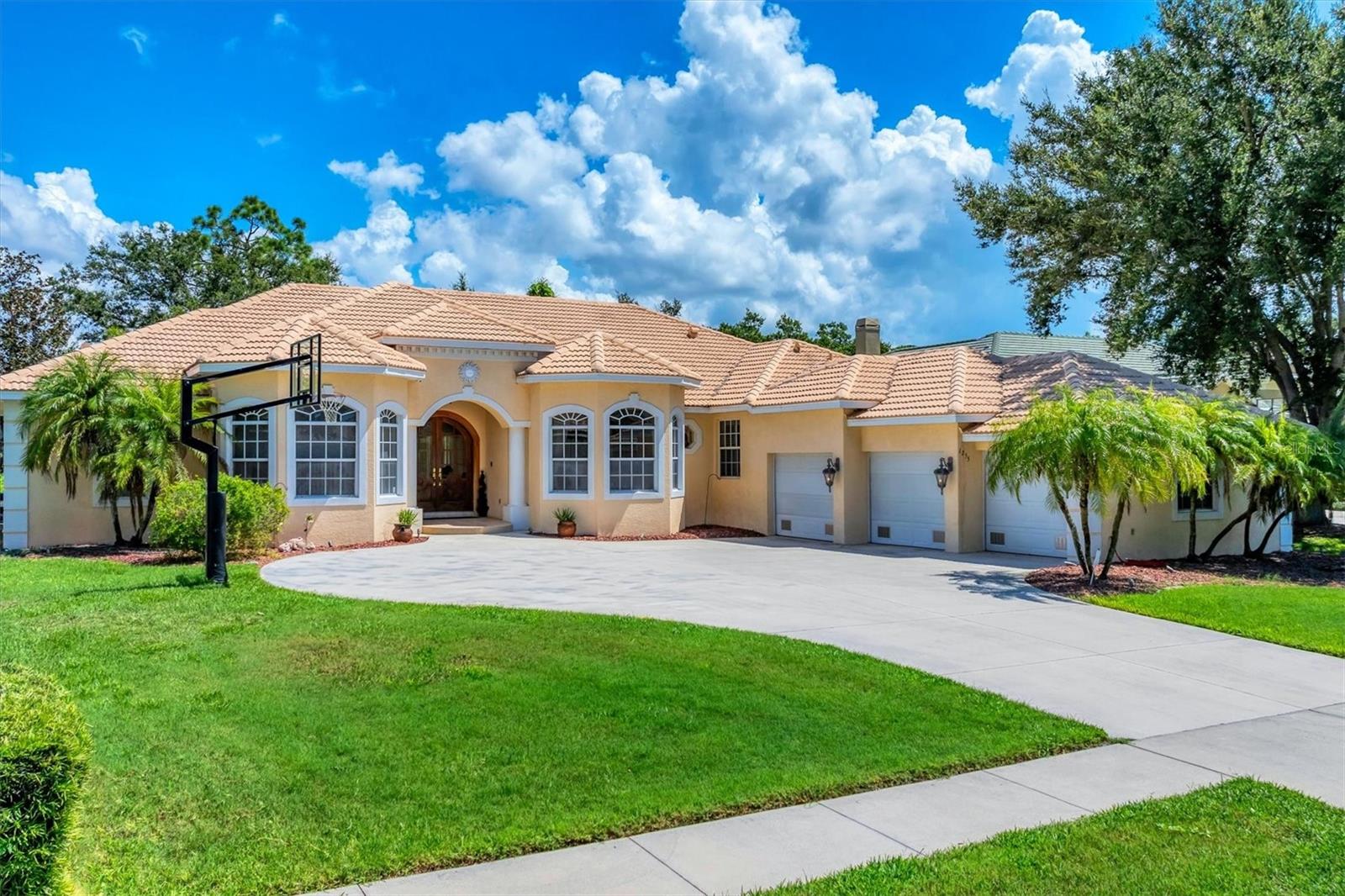 Nestled in the coveted community of Sorrento Woods, this magnificent custom-built residence by renowned builder Tony Fiore offers an extraordinary opportunity for those seeking a truly unique and private retreat. A rare gem, this meticulously maintained 4-bedroom estate, complemented by a dedicated den and 3.5 lavish bathrooms, is designed for those who appreciate timeless elegance blended with thoughtful upgrades at every turn.
As you approach, grand solid mahogany double doors set the tone for the sophistication that awaits inside. Upon entering, you're immediately greeted by breathtaking sightlines through expansive pocketing glass sliders, unveiling an enchanting view of the resort-style heated pool and an expansive 1,500 sq ft screened lanai sanctuary. An outdoor culinary haven, complete with a top-tier built-in kitchen, makes this alfresco space a host's paradise — seamlessly accessible from the family room, the luxurious primary suite, a guest bedroom, and a conveniently placed pool bath.
The owner's wing is a personal sanctuary of indulgence. Walk through a beautifully crafted gallery adorned with intricate tile designs to discover dual oversized walk-in closets, each thoughtfully outfitted with custom organizers. The spa-inspired ensuite bathroom is a masterwork of craftsmanship, featuring designer tile artistry, gleaming granite surfaces, Medallion solid wood cabinetry, a discreet walk-in shower with triple shower heads, a sumptuous soaking tub adorned with bespoke fixtures, and a private water closet. Integrated surround sound transforms bath time into an immersive, tranquil experience.
Designed with a desirable split bedroom layout, this home ensures privacy for family and guests alike. Each bedroom is generously proportioned, boasting plush carpeting, custom built-ins, walk-in closets with organizers, and individual access to well-appointed bathrooms.
Every detail of this home reflects refined craftsmanship — from rich 8-inch crown moldings, stately 10-foot ceilings, and artisan 8-foot solid core doors, to the exquisite ceiling fans with decorative medallions. The main living areas are graced with 17-inch ceramic tiles, meticulously installed over enhanced subflooring to prevent cracking, while elegant tray ceilings add architectural allure to both the formal dining and family rooms.
For the culinary enthusiast, the chef’s kitchen is a masterpiece in both form and function. Featuring premium Medallion cabinetry with soft-close drawers, a Subzero panel-front refrigerator, double convection ovens, warming drawer, and high-end KitchenAid appliances, this kitchen is designed to inspire. A sprawling island with a built-in vegetable sink and pot filler, diamond-patterned backsplash, and a walk-in pantry with roll-out shelving complete this exquisite space.
Additional features include a spacious three-car garage with a professionally finished floor, an adjustable pro-grade basketball hoop, and a lushly landscaped half-acre homesite offering privacy and ample space for outdoor enjoyment.
Perfectly positioned just minutes from the pristine shores of Venice Beach, as well as boutique shopping, dining, and quick access to I-75, this residence is a rare offering. Custom homes of this caliber, with single ownership history, are a treasure seldom found.