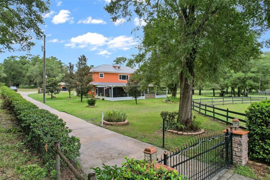 Welcome to 35126 William Lane, a rare 20-acre Eustis estate offering rolling pastures, multiple metal buildings, and a spacious 5,536 sq ft residence designed for privacy and upscale country living. The 4-bedroom, 6.5-bath custom home features a durable metal roof, dual tankless water heaters, a fully renovated kitchen, and a main-floor primary suite. An expansive 46.5' x 24' screened lanai with outdoor kitchen overlooks panoramic pasture views, and a wraparound porch adds classic Southern charm. Additional highlights include an upstairs office, abundant natural light, and generous living spaces ideal for entertaining or multi-generational living.

This property includes several high-value outbuildings: a 56' x 28' red-iron metal building with air-conditioned office and full bathroom; a 35' x 48' workshop with car lift and its own bathroom; and a 15' x 30' storage building for equipment. Lifestyle amenities include a free-standing sauna with shower and a treehouse with full bathroom. With 20 fenced acres suitable for equestrian use, agriculture, recreation, or business needs, this estate offers exceptional flexibility. Located minutes from grocery stores, 10 minutes to Downtown Eustis, 15 minutes to Mount Dora, 45 minutes to Orlando, and under an hour to theme parks. This is a rare opportunity to own a multi-use luxury estate in North Lake County.