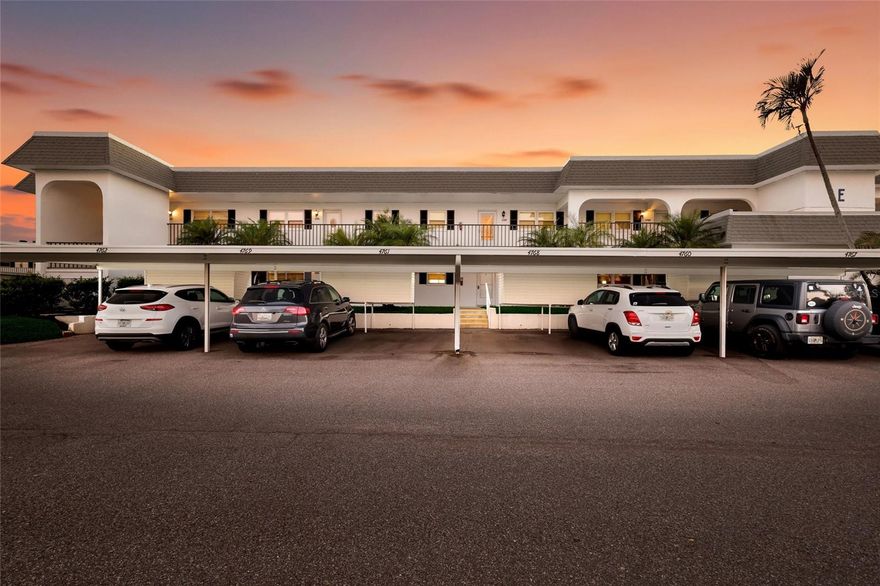 Welcome to Mount Vernon, a well-established 55 and over waterfront community consisting of condominiums, town homes, and single-family homes. The condominium you are looking at is located on the banks the intercoastal overlooking Sarasota Bay. The building is elevated to have been untouched during the hurricanes of 2024. The home has a panoramic view to the southwest from the wall-to-wall patio doors giving you fabulous sunsets most of the year. The same view is visible from the primary bedroom. The condominium consists of two bedrooms, two bathrooms, and a large open floor plan that spans nearly the entire length of the condominium. The original Florida room was opened to the home sometime in the past and is air conditioned. The kitchen overlooks the living area with a large granite countertop separating them. There are new vanities, sinks, plumbing fixtures and toilets in both bathrooms. The water heater, garbage disposal and dishwasher were replaced in 2025. The existing refrigerator works. However, seller will provide a credit at closing for a replacement. The condominium has been refreshed and is ready for your up-to-date personal touches. Your assigned parking space is right in front of your front door. The community is golf-cart friendly and has no upcoming assessments There is a community building with a gathering room with weekly activities, a pool, pickle ball courts, shuffleboard court and walking and bike paths. This is a perfect snowbird community. It is just what you need to get away from winter and enjoy living in paradise. Did I forget to say that you are about two miles from the gorgeous beaches of Anna Maria Island and short drive to shopping, restaurants, hospitals, and Sarasota Airport.