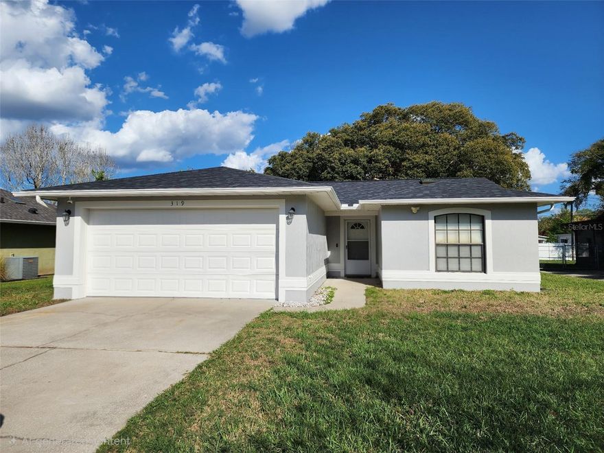 Charming and move-in ready, this beautifully updated home offers an open-concept layout with abundant natural light and thoughtful upgrades throughout. The renovated kitchen features granite countertops, stainless steel appliances, a convection oven, upgraded soft-close cabinetry, and seamless flow into the main living areas—perfect for everyday living and entertaining. Stylish Allure Ultra vinyl plank flooring runs throughout the home, complementing the bright and modern interior. Skylights in the Great Room and hall bath create a light-filled atmosphere, while the owner’s suite includes a walk-in closet for added convenience. An additional linen closet located in the hallway near the hall bathroom provides extra storage and functionality.

Additional improvements include a newly installed step-in shower wall in the Owner's en-suite bathroom (no tub), fresh interior touch-up and exterior paint, and a roof replacement completed in October 2025. The deep 2-car garage is bright and functional, featuring a window for natural light, washer and dryer, mounted tool panel with ample space for storage and projects, and attic storage space with pull-down aluminum stairs for easy access. Enjoy Florida living outdoors with a large shaded backyard highlighted by two mature camphor trees and an open patio perfect for relaxing or entertaining. NO HOA! 

Ideally located just a short walk from the serene St. Cloud Lakefront and only minutes from the Turnpike, Lake Nona, St. Cloud grocery stores, restaurants, schools, shopping, and major conveniences, this home combines comfort, character, and an exceptional location.