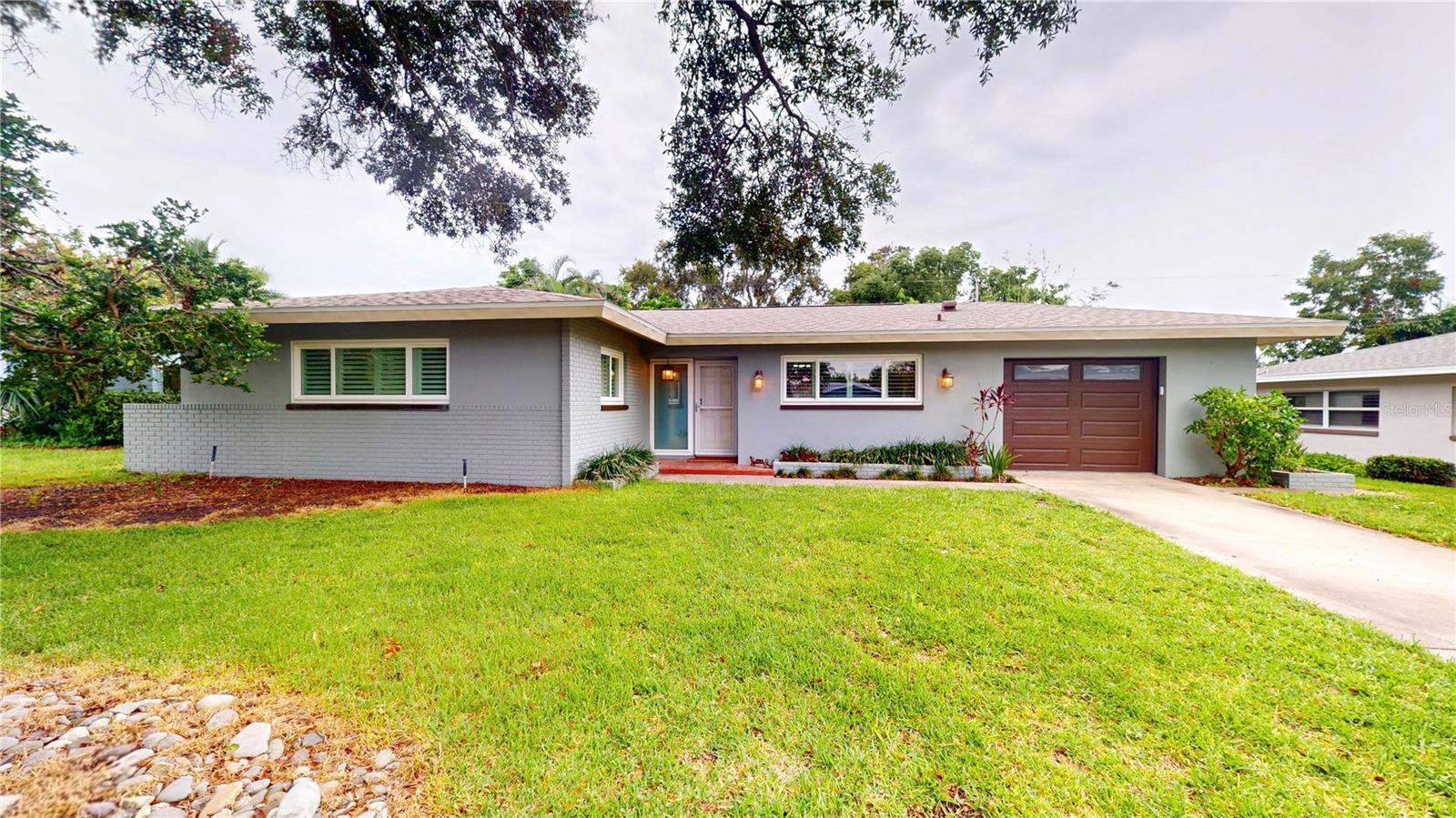 Welcome to this inviting 3 bedroom, 2 bath home in the heart of Largo offering comfort, style, and convenience. Step inside to find beautiful terrazzo floors throughout the main living area and a bright kitchen with stainless steel appliances. Sliding glass doors lead to the spacious Florida room surrounded by windows, perfect for relaxing or entertaining.
The laundry area is conveniently located in the garage just off the kitchen, and the home’s thoughtful updates include plantation shutters (2021) and a new roof (March 2025). Enjoy Florida living in the large backyard with a paver patio, ideal for gatherings or quiet evenings outdoors.
With no HOA, no flood insurance required, and a prime location just minutes to the Gulf Beaches and Largo Central Park Performing Arts Center, this home offers outstanding value and lifestyle.