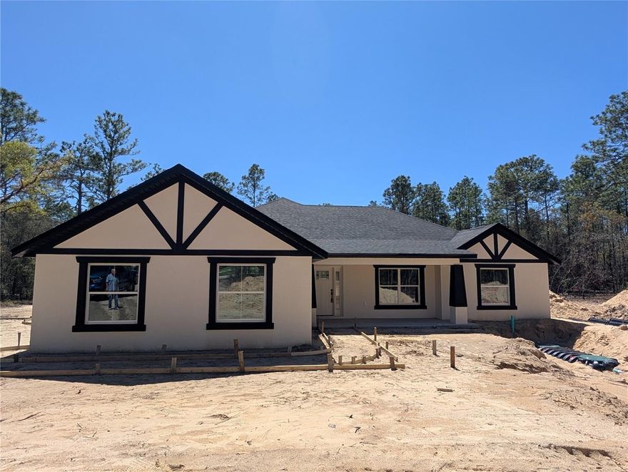 Under Construction. NEW CONSTRUCTION | 1.12 ACRES | COMPLETION MID-April
Experience modern elegance in this 2,249 sq. ft. (3,203 total under roof) San Nicolas II model  by Brick City Builders. Nestled on a sprawling 1.12-acre lot in Rolling Hills, this 3BR 2Bth + Den home is designed for the  Ocala lifestyle.
-Open-Concept Living: Soaring cathedral ceilings and high-end LVP flooring throughout the main living areas.
-Kitchen: Sleek quartz countertops and custom wood cabinetry optimized for hosting.
The "Work-From-Home" Den: A versatile dedicated office or library space off the main entry.
Indoor-Outdoor Flow: Elegant French doors lead from the great room to an expansive covered back porch, perfect for enjoying quiet Florida evenings.
Owner’s Sanctuary: Master suite features "his and her" closets and a spa-inspired bath with a deep soaking tub and custom-tiled walk-in shower.
Curb Appeal: A side-entry 2-car garage preserves the clean, custom lines of the front elevation.

Peace of Mind: Full One-Year Builder Warranty included.
**Seller is a licensed Real Estate Agent.**