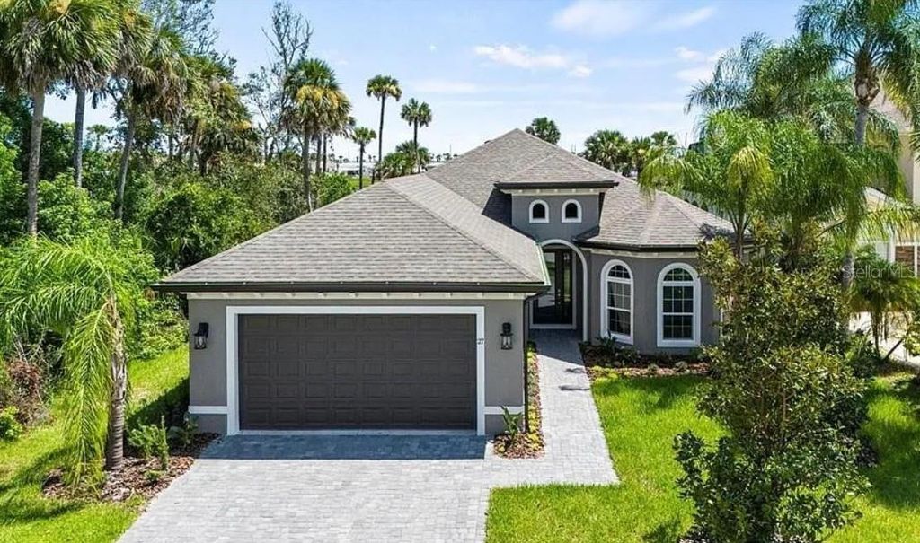 Photo of 27 S Riverwalk Drive, Palm Coast, FL 32137 (MLS # FC313605)