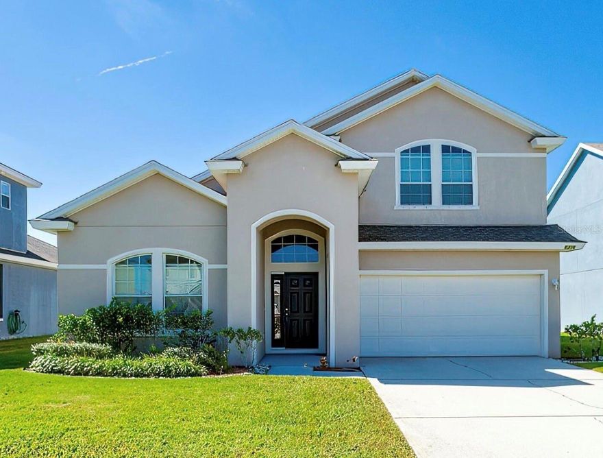 Lake front and Move in Ready! High and Dry! Great family home with 4 bedrooms and 2.5 bathrooms in the desirable Coquina Cove subdivision. The kitchen, overlooking the family room, has beautiful wood cabinets, breakfast bar seating and full stainless steel appliance package. Sliding doors lead from the living room to the back patio where you can relax and enjoy the gorgeous lake view. Spacious primary bedroom and the ensuite features double sink vanity, garden tub and walk-in shower. Upstairs features a spacious loft perfect for a media/game room or den. Great location close to the Coraci Sports Complex, shopping, restaurants, movies, medical facilities, I-95, the beach and so much more. All information recorded in the MLS is intended to be accurate but cannot be guaranteed. ;Water: City