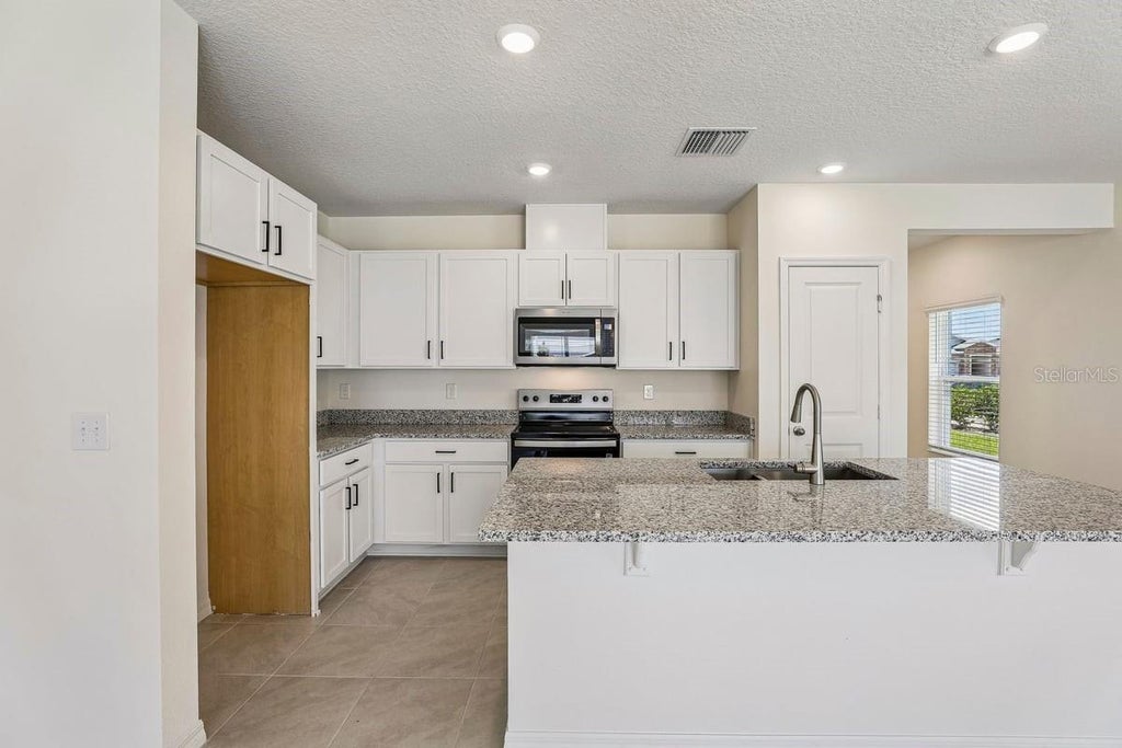 Photo of 647 Meadows Edge Place, Lake Wales, FL 33859 (MLS # O6443305)