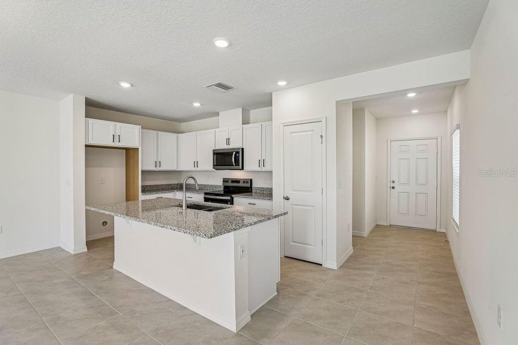 Photo of 647 Meadows Edge Place, Lake Wales, FL 33859 (MLS # O6443305)
