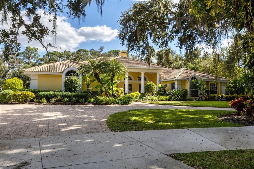 Incredible Opportunity combining Luxury with Privacy behind the gates of prestigious Laurel Oak Community. This grand estate features 1.2 acres of canopied tress nestled amongst gorgeous oaks in your private oasis. As you enter this custom home with endless possibilities of multiple gathering and dining areas or game room combinations for entertaining or relaxing with captivating views of the expansive lush landscaping. The open design graciously flows to the meticulously remodeled gourmet kitchen with Fulgor appliances, Cambria Quartz surfaces with ample cabinet space and a walk in pantry. The generous island with seating and a peninsula with additional cabinets/counters overlooking the family room makes this the perfect home for entertaining guests. Retire to the spacious master suite featuring an additional sitting area or office space with rich bamboo flooring. The master bath includes his and her vanities with a separate shower and tub with 2 closets. This split floor plan offers privacy with 3 additional bedrooms and 2 baths plus a beautiful study with wainscoting and french doors. The laundry room has been completely updated with organizational built ins and additional storage. This home emphasizes beautiful views both inside and out with plentiful windows and sliders creating the perfect atmosphere. As you step outside you will embrace the Florida lifestyle with just the perfect combination of golf course and private preserve. Relax and unwind by this grand pavered lanai with so much outdoor living and multi level covered area surrounding the saltwater heated pool/spa with pebble tec finish. There is a recently updated outdoor kitchen with custom cabinets, granite and a commercial griddle, perfect for a BBQ with friends or family. Additional special features include an exercise room with sauna for fitness enthusiasts as well as an outdoor Celebrity putting green and a dog run for the canines. Laurel Oak Estates is truly one of a kind with winding streets and incredible trees and lakes abound. It is a 24 hour guard gated Community with optional Country Club Membership offering 2 18 hole Championship golf courses, unparalleled Har- Tru Tennis courts (12), 8 Pickleball courts and a Jr Olympic sized Pool/Patio with Splash bar. As if that isn't enough there is a completely renovated Clubhouse with Lounge and recently opened Outdoor Patio Dining. There are countless social activities and events for everyone. The community location is so convenient to shopping, restaurants, A rated schools and only a short distance to the world renowned Siesta Key Beach. Come enjoy the charm of the Laurel Oak Lifestyle and this Impressive Estate to call home!