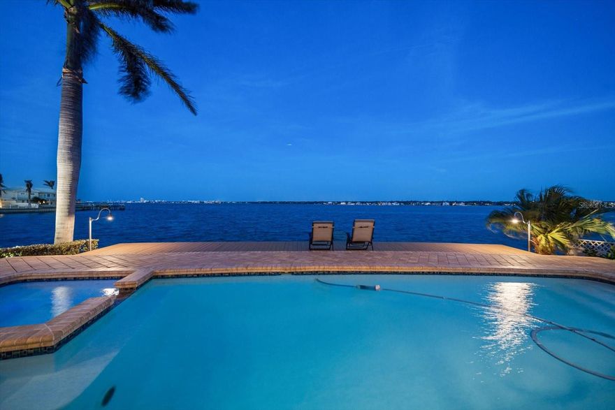 Welcome to waterfront living at its finest in Belleair Beach! Positioned high and dry during Hurricane Helene, this exceptional property offers 119 feet of unobstructed deep-water frontage—perfect for boating enthusiasts with direct Gulf access. The unique lot placement ensures the dock is set to the side, preserving panoramic views of the Intracoastal Waterway from nearly every room.

This beautifully updated 2-bedroom, 3-bathroom home (currently configured as 2 bedrooms + den that could be converted back to a 3rd bedroom) boasts a spacious 2,679 sq. ft. layout on a private, oversized lot. Inside, enjoy a light-filled open floor plan with ceramic tile flooring, a wood-burning fireplace, and expansive windows framing tranquil water views. The chef’s kitchen features Corian countertops, Fisher Paykel drawer dishwasher, reverse osmosis drinking water filtration, and seamless flow into the dining and living spaces—ideal for entertaining.

Retreat to your private backyard oasis, complete with a heated pool and spa (refinished with durable fiberglass), SunSetter awnings, and a fully renovated patio with sun-filtering shades and plantation shutters for ultimate comfort. The north zone HVAC system was fully replaced in 2023, and the roof was redone in 2018, ensuring peace of mind.

Waterfront highlights include a grandfathered dock replacement opportunity, providing flexibility for future upgrades. Enjoy serene mornings spotting dolphins, evening fireworks on the horizon, and the privacy that comes with a prime cul-de-sac location.

Residents of Belleair Beach enjoy private beach access, parks, tennis courts, and the relaxed charm of this coveted Gulf Coast community—all while being just minutes from top dining, shopping, and entertainment.

If you’re looking for privacy, panoramic water views, and endless potential, this is the home for you.