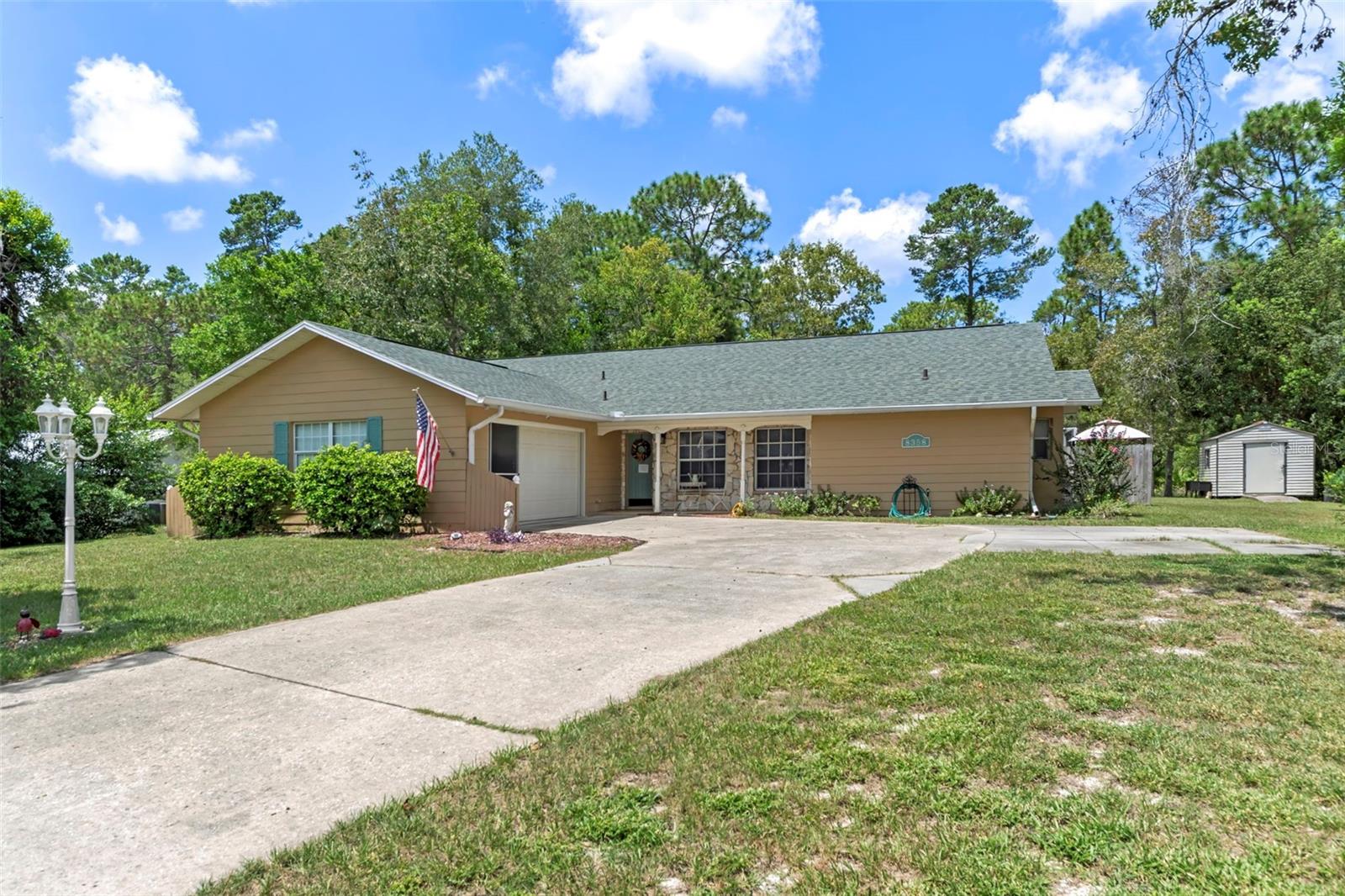Welcome to this immaculate 3-bedroom, 2-bathroom pool home nestled on over half an acre in the heart of Weeki Wachee! With no HOA or CDD fees and with recent updates including a 2023 HVAC and 2021 roof, this home offers both peace of mind and timeless charm. A welcoming 10-foot front porch with stone accents overlooks a pond, setting the stage for the stunning interior.
Step inside to the foyer leading into the spacious 21x14 living room, featuring a cathedral ceiling with real wood beams, fresh carpeting, chair rail accents, and pocket sliders opening to the rear lanai. The dining area boasts bay windows and additional sliders for seamless indoor-outdoor living, while the thoughtfully designed galley kitchen includes abundant cabinetry—some with glass fronts, and a 9-foot breakfast bar. A large inside laundry room features extra storage and a laundry tub.The primary suite is a true retreat, complete with crown molding, private lanai access, a 9x7 walk-in closet, and an en-suite bath with a tub/shower combo. Two oversized guest bedrooms (14x13 and 16x13) share a well-appointed guest bath with a tiled shower and abundant vanity space. Updated hardware throughout the home adds a modern touch.Step outside to enjoy Florida living at its best! Relax under the 26x11 covered lanai with pavers, or into the sparkling 24x12 saltwater pool with child safety fence, all under a 24x17 screened enclosure. The expansive backyard offers partial fencing, mature landscaping, and no build behind—preserving your privacy and the natural Nature Coast feel. Additional highlights include a side-entry screened 2-car garage with extra parking pad, an 8x10 detached storage shed, whole-home surge protection, and a transferable pest control contract.Conveniently located near schools, shopping, and all the charm Weeki Wachee has to offer, this home blends comfort, updates, and character in one perfect package. Don’t miss your chance to call this retreat your own!