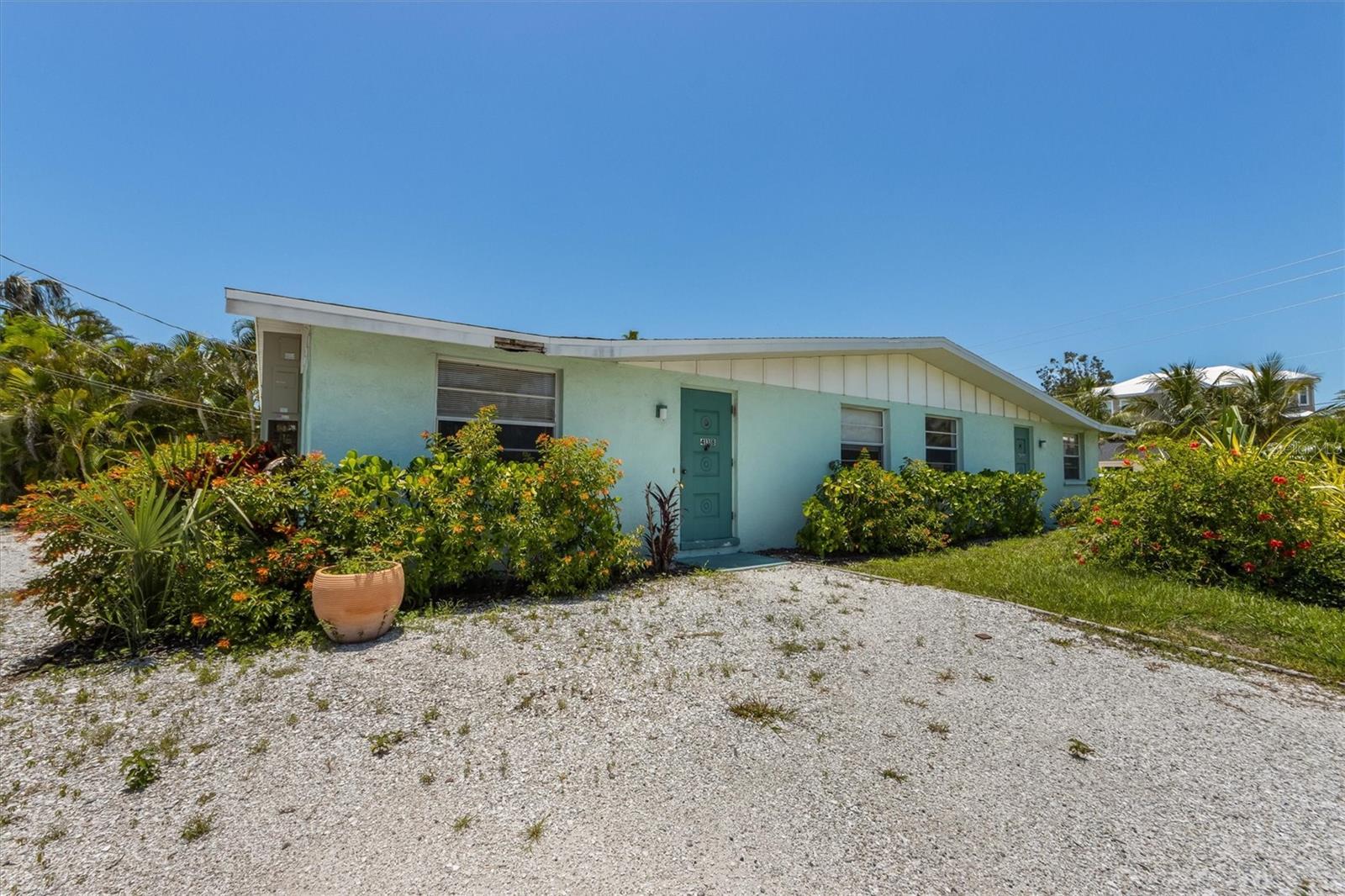 Incredible opportunity on the North end of Anna Maria Island. Located in the heart of the city of Anna Maria. Short walks to the Gulf or Bay beaches and all of the lovely attractions on Pine Avenue. Currently on the massive, lots 3&4, 11,500 square foot lot sits two duplex units. A total of FOUR short term 2 bed 1 bath units in Anna Maria!!! Units are ready for your vision, just waiting to become instagram famous. Units like this are few and far between on the North end. 3 of 4 units are equipped with washer/dryer hookups. If having the most famous duplex in Anna Maria is not your thing, then there is potential to build two single family homes on lots 3&4 or an enormous single family home. The gentlemen who acquired this property more than a half century ago had a dream for his family, now it's your turn.