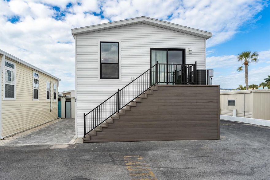 Island Living at Its Finest – Brand New Home on Longboat Key. Welcome to Gulfshore of Longboat, a highly desirable waterfront co-op community offering private beach access, boat docks, and sweeping views of the Gulf of Mexico and Sarasota Bay. This beautifully built 2-bedroom home combines modern efficiency with relaxed coastal living. An outdoor bath with a shower is a wonderful convenience for those enjoying the pool or boating.  Step inside to an open, sun-filled floor plan featuring soaring ceilings with tray accents in both the living room and the primary bedroom, creating a bright, spacious atmosphere throughout. The kitchen is designed for everyday comfort and entertaining, complete with a center island, hardwood shaker cabinetry with soft-close doors and drawers, and a full stainless appliance package including refrigerator with ice and water, range, dishwasher, microwave, and garbage disposal. Built to current HUD hurricane standards and Energy Star certified, the home offers peace of mind with 2x6 construction, upgraded insulation, and low-E vinyl windows for year-round comfort and efficiency. Enjoy mornings at the private beach, afternoons at the heated pool, and evenings watching sunsets over the water. The community clubhouse hosts regular activities, making it easy to relax and connect with neighbors in a friendly coastal setting. Whether you’re looking for a winter retreat or full-time residence, this move-in-ready island home delivers comfort, security, and the lifestyle Longboat Key is known for. Schedule your private showing today and start living the Gulf Coast dream.