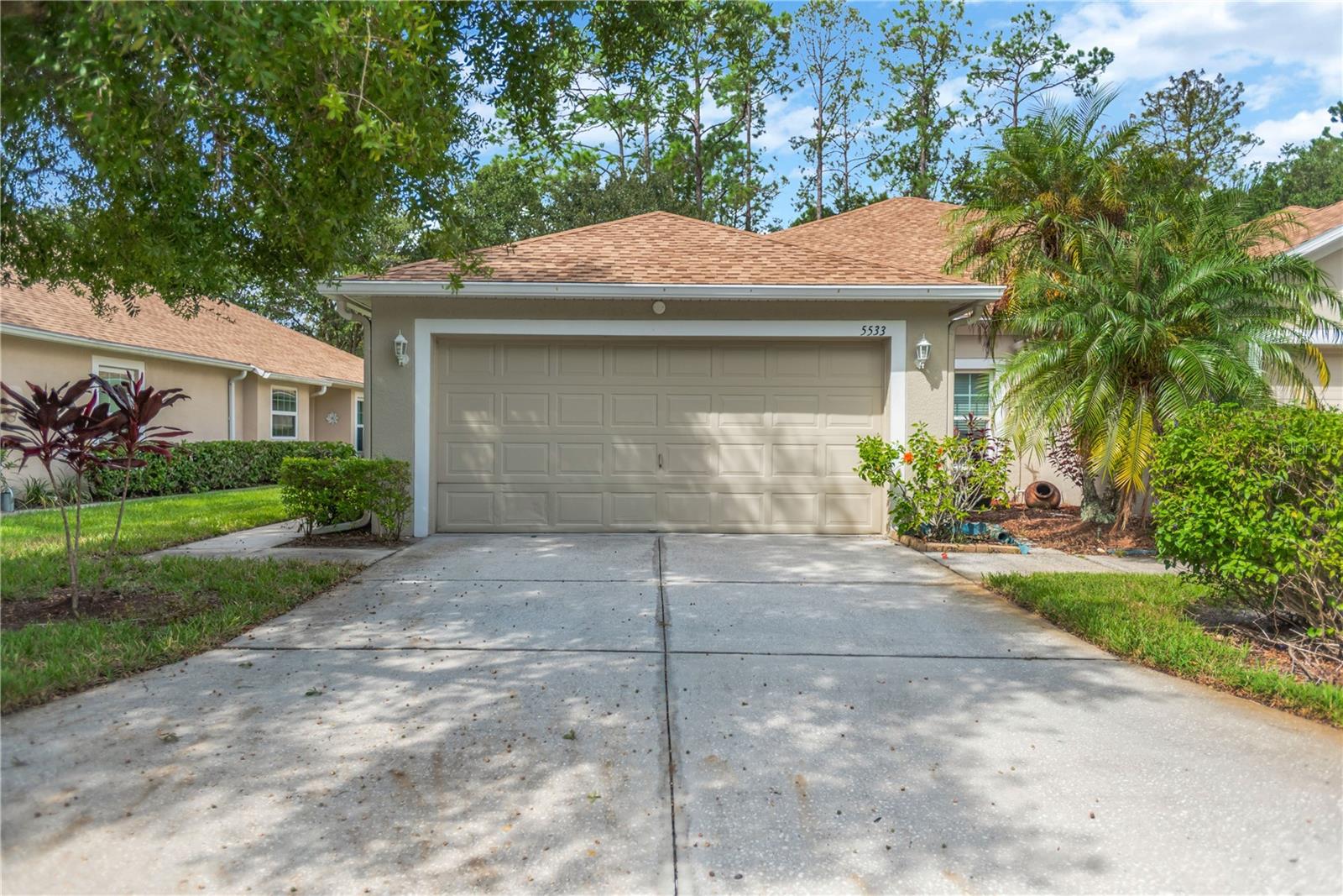 This Lake Bernadette VILLA is perfect in every way! A great rental starts with NO carpet anywhere! Tile and MOHAWK laminate flooring throughout the home. This 3 bedroom, 2 bath, 2 car garage villa is situated on a wooded/pond view. Enjoy Nature at its best along with some extra privacy as this home is on a dead end street so less traffic will drive by. There are upgrades all over like the windows that have been replaced along with all sliding glass doors with energy efficient units. Plenty of savings on electricity on those hot days. The water heater was removed replaced with a tankless water heater. The kitchen received new QUARTZ and EPOXY counter tops and a new sink and faucets. They also added more WOOD cabinets, open shelving, and an additional bank of drawers to the kitchen. Plenty of storage in this kitchen! They even installed MORE electrical outlets for convenience. They replaced ceiling, bathroom fans and light fixtures. The bathrooms also received new vanities with Granite tops, and matching wood storage units. The entire interior was freshly painted. Gutters were replaced on the perimeter of the roof with downspouts. They even added a water softener system and added lots of storage shelves in the garage. The oversized lanai was re-done with new screening and light fixtures. The HOA includes exterior maintenance, ground maintenance & trash removal. You also have the use of the two pools, clubhouse, tennis court, playground & fitness center. Hurry! and make your appointment to see this PERFECT VILLA! It won't last!