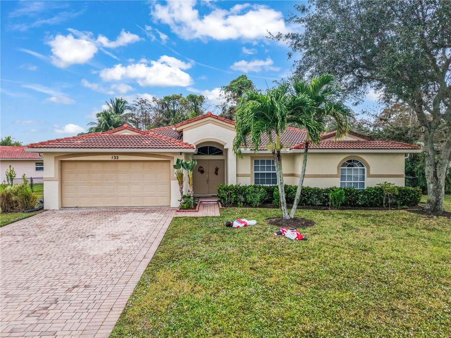 Exceptional opportunity in Royal Palm Beach! This spacious single-story home offers 1,970 sq ft of living area on an impressive 0.28-acre lot, delivering the comfort, space, and layout today’s buyers are searching for. From the moment you walk in, the welcoming foyer opens into a bright open-concept living and dining area with direct views of the large backyard—creating an immediate sense of openness and flow. The kitchen features solid wood cabinetry, excellent storage, and a sun-filled breakfast nook, making it the perfect spot to start your day. The primary suite stands out with its generous size, private sitting/office area, walk-in closet, and a spacious bathroom with double sinks. The enclosed and covered back porch adds valuable extra living space—ideal as a Florida room, entertainment area, or a relaxing retreat with peaceful garden views. Built with CBS construction and a tile roof, and located in an area that does not require flood insurance according to public records.• Minutes from Royal Palm Beach Commons Park. Near Wellington Green Mall, restaurants, supermarkets, and retail. Quick access to US-441/SR-7 and Southern Blvd. Surrounded by parks, recreational centers, lakes, and walking trails. A rare combination of size, location, and highly desirable layout—this home stands out as one of the best options currently available in Royal Palm Beach.