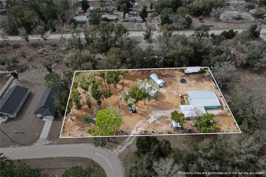 Enjoy rural living on nearly one acre with this concrete block home offering a functional layout and valuable outdoor improvements. This 3-bedroom, 1-bath residence includes a flexible office space that can serve as an additional bedroom or workspace. Recent updates include a 2022 metal roof, newer A/C system, newer septic tank, newer water heater, and remodeled kitchen and bathroom completed in 2022.

The property features two steel outbuildings: a 20×30 workshop with electric service and a 14×30 air-conditioned building with its own breaker panel, providing excellent utility for storage, hobbies, or equipment. A two-car carport offers covered parking, and the backyard overlooks open farmland for added privacy and a natural setting.

Located in a quiet rural area with no HOA and convenient access to Williston, Gainesville, and Ocala.