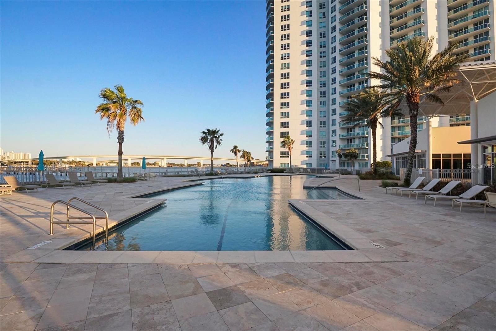 Experience luxury coastal living in this 7th-floor, 2-bedroom, 2-bath condo at Marina Grande on the Halifax. Spanning 1,670 SQFT, this residence offers breathtaking Intracoastal views from your expansive balcony, perfect for enjoying dolphins at play and stunning sunrises.
Designed for modern living, the open floor plan features 9-foot ceilings, floor-to-ceiling windows, a gourmet kitchen with stainless steel appliances, granite countertops, and in-unit laundry. The master suite is a true retreat with balcony access, water views, and a spa-like bath with jetted tub, walk-in shower, and dual sinks. Resort-style amenities include two waterfront pools, steam rooms, a fitness center, movie theater, clubhouses, and concierge service. HOA covers water, sewer, cable, internet, exterior maintenance, and two secured garage spaces. Furnishings negotiable. Don’t miss your chance to own in this highly sought-after community!