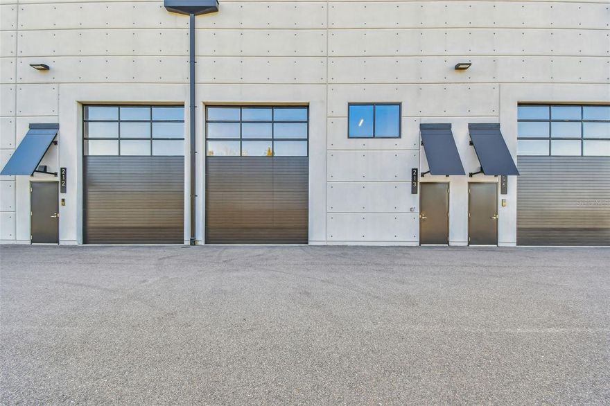 Situated on a sprawling 200-acre property, The Motor Enclave is truly a grand theme park for car enthusiasts. This private garage is 1,230 sqft with an oversized 16-foot-high insulated overhead door providing access to the unit with ease for any vehicle, including an RV.  The 28’ tall ceilings, provide room to add a mezzanine to potentially double the sqft. This blank canvas space can be customized and transformed into a dream workshop, office space or the ultimate Man Cave, while accommodating 6+ cars. Pre-plumbed water/sewer – to add a bathroom and kitchen - fire sprinklers, individual HVAC unit on the roof, insulated overhead door with electric opener, and a 6-inch-thick concrete slab that can support 2-4 post lifts or a future construction build-out or lifts. Motorsport Club membership allows access to the Performance Driving Circuit, a 1.72 mile track designed by world renowned Formula 1 track designer Hermann Tilke. You can also explore the Off-Road Experience, which has 100 acres of challenging trails with a wide range of surface conditions including rocks, water, gravel, etc. The Vehicle Dynamics Pad is a 2-acre versatile sea of pavement designed to host car shows, defensive driver training, laser-timed autocross, and much more. Owners have 24/7 access to their individual units along with having the opportunity to participate in a wide range of social activities across the property, as networking and socializing at the Enclave is a big part of the experiential automotive community. The impressive, 37,000 sqft Event Center is perfect for corporate, public, and private events. Conveniently located at the crossroads of I-75 and I-4, minutes to downtown Tampa and a quick commute to Tampa Airport.