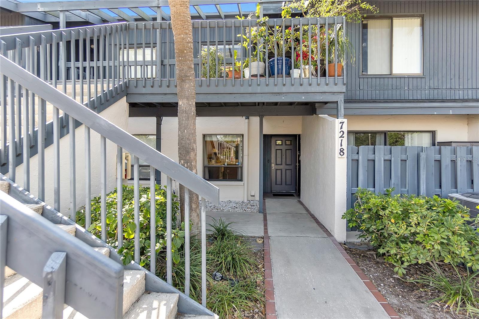 Welcome to 7218 Cloister Drive, a charming ground-floor 2 bedroom, 2 bathroom condo ideally located just 12 minutes from the nation’s number one beach, Siesta Key.
This well-maintained home offers an effortless blend of comfort and convenience. Inside, you’ll find two spacious bedrooms, two full baths, and an open living and dining space that flows beautifully to your private outdoor areas.
Enjoy your morning coffee on the front patio, and unwind in the fully enclosed back lanai, complete with retractable shades and tranquil pond views. The extended lanai runs the full width of the home and opens onto a manicured green lawn, perfect for lounging or entertaining with a view.
A short walk from your front door brings you to the community pool, where you can soak up the Florida sunshine or take a refreshing dip on warm days.
The community’s layout and lush landscaping offer a peaceful, residential feel while keeping you close to shopping, dining, and all that Sarasota has to give.
Whether you’re searching for a year-round residence or a winter escape, this move-in-ready condo is a must-see. Schedule a tour today!