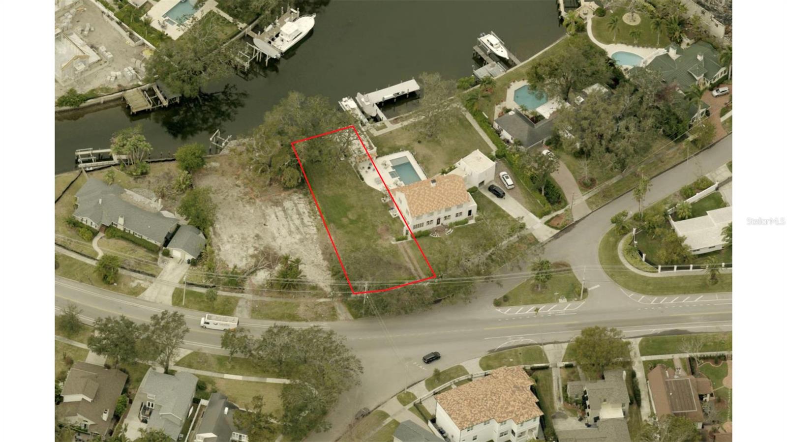 Build your dream waterfront estate on this almost a third of an acre, homesite on Davis Islands, offering direct access to Tampa Bay with no bridges to navigate. This oversized lot features approximately 75 feet of street frontage on picturesque Blanca Avenue and 55 feet of seawall frontage along a wide, navigable canal—ideal for boating enthusiasts. With a lot depth of 185 feet and mostly cleared land, the property offers an expansive canvas for a custom home that captures the best of waterfront living.
Located in one of South Tampa’s most desirable neighborhoods, Davis Islands offers an unmatched lifestyle with top-rated schools, charming local shops and restaurants, scenic trails, and golf cart-friendly streets. Enjoy proximity to Tampa General Hospital, Peter O. Knight Airport, a public marina, parks, tennis courts, a beach, and vibrant downtown destinations like Water Street, Sparkman Wharf, and the Tampa Riverwalk.
Whether you’re looking to create a luxurious private retreat or a showstopping modern estate, this rare opportunity combines location, water access, and lot size in a way few properties can.
The seller will deliver the site cleared of all structures. This offering is only for the southern 0.28 acres and is subject to the approved lot split.