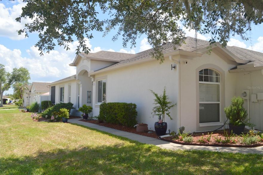Stunning, Spacious, and Immaculately Maintained Villa in Highly Sought After Longleaf at Meadow Pointe. Welcome home to this gorgeous and generously sized villa located in the ever popular Longleaf community of Meadow Pointe. Offering three true bedrooms plus a versatile flex space, this layout is perfect for anyone needing an office, den, study, or hobby room. With two bathrooms, a two car garage, a screened lanai, and the rare luxury of a large private fenced backyard, this home delivers comfort, privacy, and functionality. Upgrades include a new PEX plumbing system, providing superior durability and peace of mind for years to come. Step inside and you’ll immediately appreciate the rich luxury vinyl flooring that flows beautifully throughout the main living areas. The chef inspired kitchen is designed to impress—fully equipped, thoughtfully laid out, and features a large island that stays, making it ideal for cooking, entertaining, or casual dining. This villa offers exceptional value with low HOA fees that include exterior painting (Painted in 2025), lawn care, limited roof repair, roof replacement, and reserves for both roof and painting. The village also benefits from reclaimed water for irrigation, keeping your landscaping lush and cost efficient. Residents of Meadow Pointe?II enjoy access to outstanding amenities, including a clubhouse, fitness center, community pool, tennis and basketball courts, and playground—all just minutes from your front door. Located in the heart of Wesley Chapel, this home is close to everything: top rated schools, shopping, restaurants, hospitals, the University of South Florida, Pasco Hernando State College, parks, walking and biking trails, and easy access to major interstates for effortless commuting.