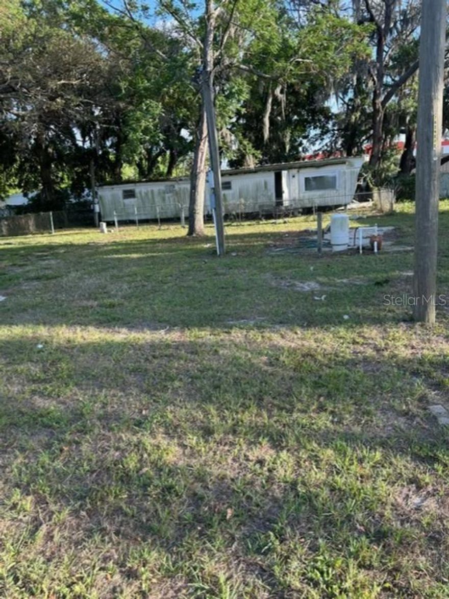 Manufactured home located on large lot.  Unit needs tlc including flooring, paint, bathroom updated, kitchen updated, etc.  Newer well pump and water tank at property.  Large lot.