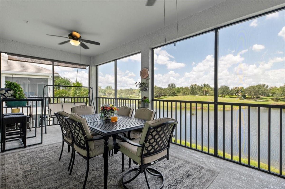 Experience Classy Coastal Living at Tidewater Preserve. Welcome to 935 Tidewater Shores Loop, an elegant and classy coach home in the sought-after gated community of Tidewater Preserve in Bradenton. Built by WCI/Lennar in 2020 and lovingly maintained by its original owner, this 3 bedroom, 2 bath split floor plan offers over 2,100 square feet of beautifully designed living space with high ceilings and serene pond views. Step inside to discover an open great room layout with diagonal tile flooring throughout the main living areas and plush carpeting in the bedrooms. The heart of the home is the beautiful kitchen, featuring a massive 10+ foot island, quartz countertops, stainless steel appliances, under-cabinet lighting, stylish backsplash, a walk-in pantry, and elegant crystal pendant lights that add a modern sparkle to the space. The spacious primary suite is a peaceful retreat with private access to the screened lanai, two LARGE walk-in closets—one with custom built-in shoe storage—and a luxurious ensuite bath complete with dual vanities, glass shelves, and a stunning 30 square foot walk-in shower. A private guest wing includes two additional bedrooms (one with built-in bookshelves), both have walk-in closets, a full bath with a tub/shower combo, and a laundry room with upper cabinets for added storage. Relax on the covered, screened lanai with No-See-Um screening, dual ceiling fans, a roll-down shade, and tranquil views of the pond and lush landscaping.
Additional upgrades and features include: Oversized 2-car garage, smart home features with Ring doorbell, new lighting throughout, including crystal “fandaliers” in the living and primary bedrooms, custom stair runners, upgraded paint and stair rail stain, added cabinetry in laundry and guest bath, and a hidden bonus: under-stair storage space that’s ideal for seasonal items or extras. Tidewater Preserve offers a low-maintenance lifestyle with resort-style amenities: clubhouse, 3 pools, fitness center, walking trails, tennis courts, dog park, playground and a marina (first come and with additional fees) with access to the Manatee River and beyond. If you're seeking a stylish, low-maintenance, Florida lifestyle in a waterfront community, this is the one. Schedule your private showing today! Seller may consider offering owner financing with and acceptable offer.