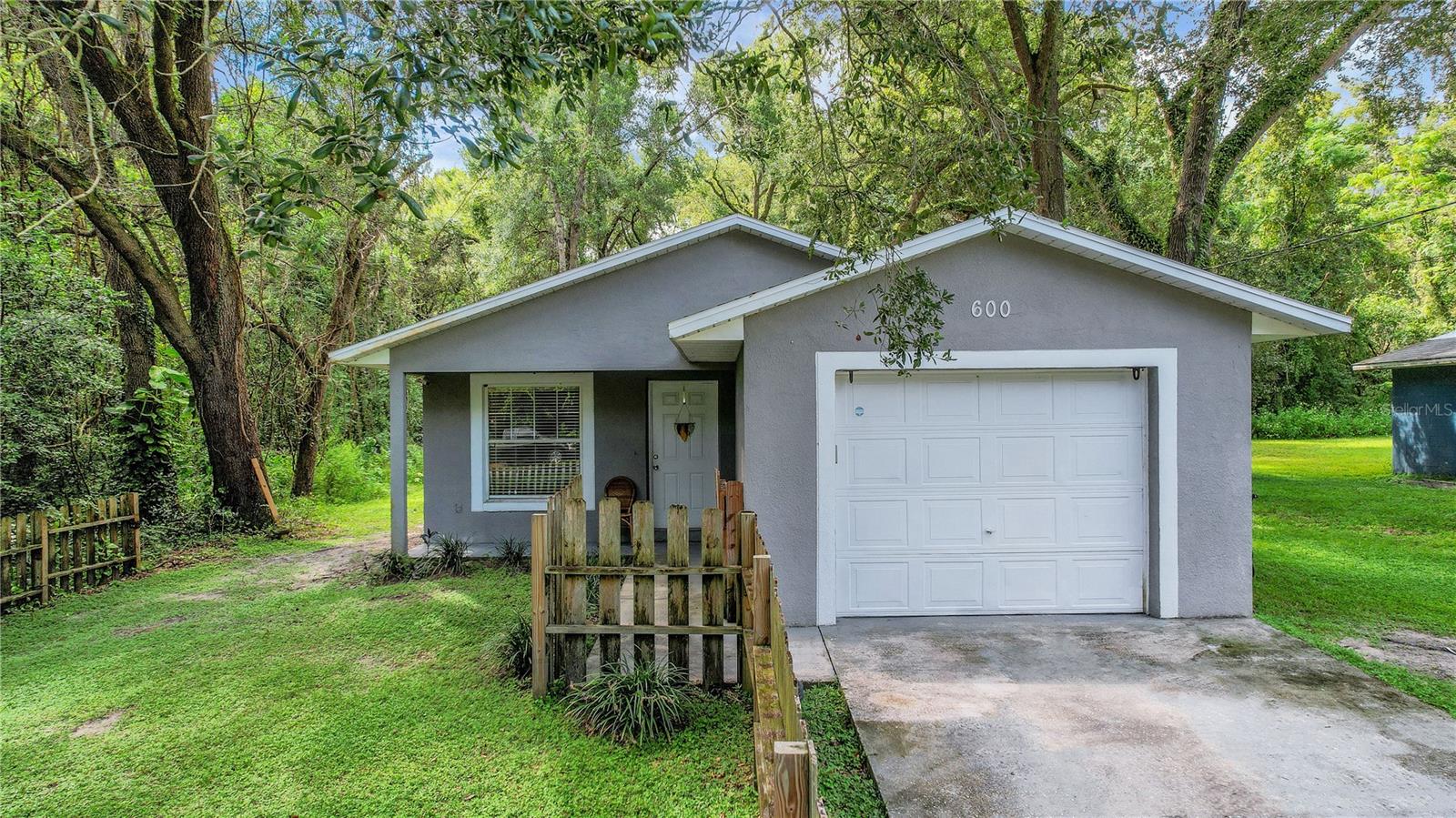 Welcome to this charming 3-bedroom, 2-bathroom 1 car garage home offering 1,092 square feet of comfortable living space on an oversized lot (.33 acre). Inside, you’ll find NO POPCORN Ceilings along with beautiful Vinyl plank flooring throughout—no carpet—and an abundance of natural light. The modern kitchen features stainless steel appliances, granite countertops, and beautiful white cabinetry. The spacious primary suite includes a private ensuite with a stone-topped vanity and a tub/shower combo, while all bedrooms boast walk-in closets. Additional peace of mind comes with a newer roof (2022), HVAC (2019) and Water Heater (2019). Conveniently located in Wildwood, just minutes from shopping, dining, and everyday conveniences.