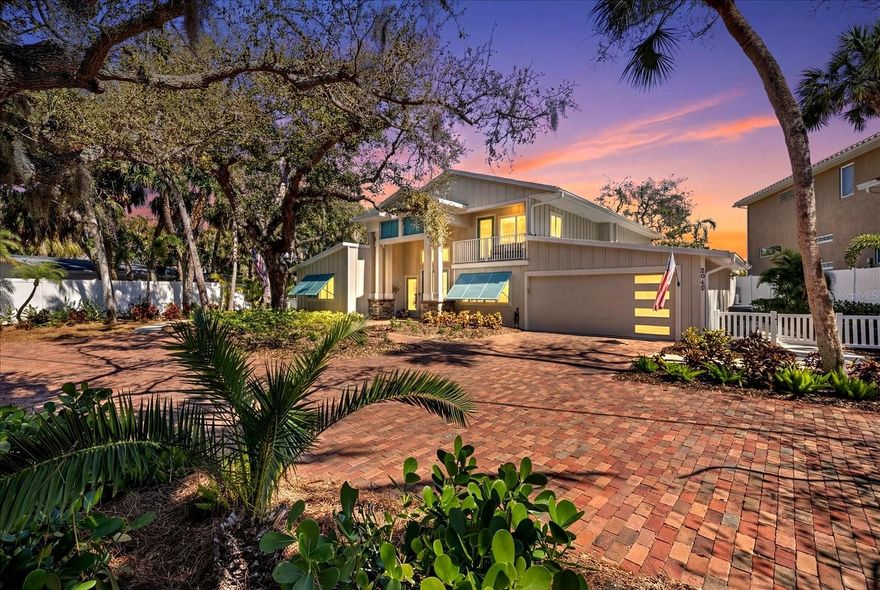 Exceptional new waterfront offering on the Grand Canal of Siesta Key. Located on a quiet, picturesque canopy road, this coveted property delivers deep-water boating, and a new 31' dock and 10,000 lb. lift. Rare 100' stretch of unspoiled waterfront frontage. Quick access to Sarasota Bay and the Gulf. Designed for elevated coastal living, the residence offers expansive living areas, elegant finishes, and seamless indoor-outdoor flow ideal for entertaining and everyday luxury. Positioned on a double lot, with a stately motor court surrounded by opulent landscaping, the home offers a welcoming atmosphere. The kitchen is expansive, beautifully redesigned, and built for hosting large gatherings; a Culinary Haven with a Chef's Island as the centerpiece, complete with top-of-the-line appliances, including a Wolf 6-burner gas range, a Sub-Zero refrigerator, and a secondary Sub-Zero refrigerator is also included. A nugget ice maker, and wine fridge in the dining room's dry bar sets the tone, with a luxurious dining room offering a large space for dinner parties, also could double as a formal living room. There are two primary suites, one downstairs, and one upstairs. The downstairs suite is perfect for guests or an in-law unit. The second-floor primary suite is a private retreat, elevated above it all and wrapped in natural light. Large windows frame tranquil canal views and lush, mature landscaping, creating a serene, tree-lined outlook that feels both peaceful and secluded. The main primary bath, a dream en-suite bath, a luxurious area that incorporates dual sinks, a rainfall glass enclosed shower, separate soaking tub, and private water closet. A voluminous walk-in closet, with a built-in vanity, acts as the quintessential, functional anchor. An additional 1 to 2 guest bedrooms on the second floor, with a 4th full bath. 2nd floor loft/game room is a perfect room for a getaway, or read a book on its outdoor terrace. Back downstairs is a home office, a private workspace. The first floor family room is a large media room with sliders to access the lanai, and the two-story pool cage that will be a family favorite, with its salt water pool and spa. Step outside and fire up the grill. The expansive outdoor living area is designed for effortless gatherings and all-day enjoyment. An outdoor kitchen with a built-in grill, and eat-up bar, allows for making it easy to host everything from casual lunches to evening cookouts. Multiple table spaces offer comfortable shaded seating, perfect for dining, games, or lingering conversations. Completely renovated estate. This beautiful home is essentially brand new. A grand space that's Just minutes from the sugar-sand shores of world-famous Siesta Key Beach, once again voted the number 1 beach in America by TripAdvisor, along with premier dining, night life at Siesta Key Village, and endless boutiques for shopping. One of Siesta Key's most desirable waterfront locations. Come experience a serious boater's dream come true!