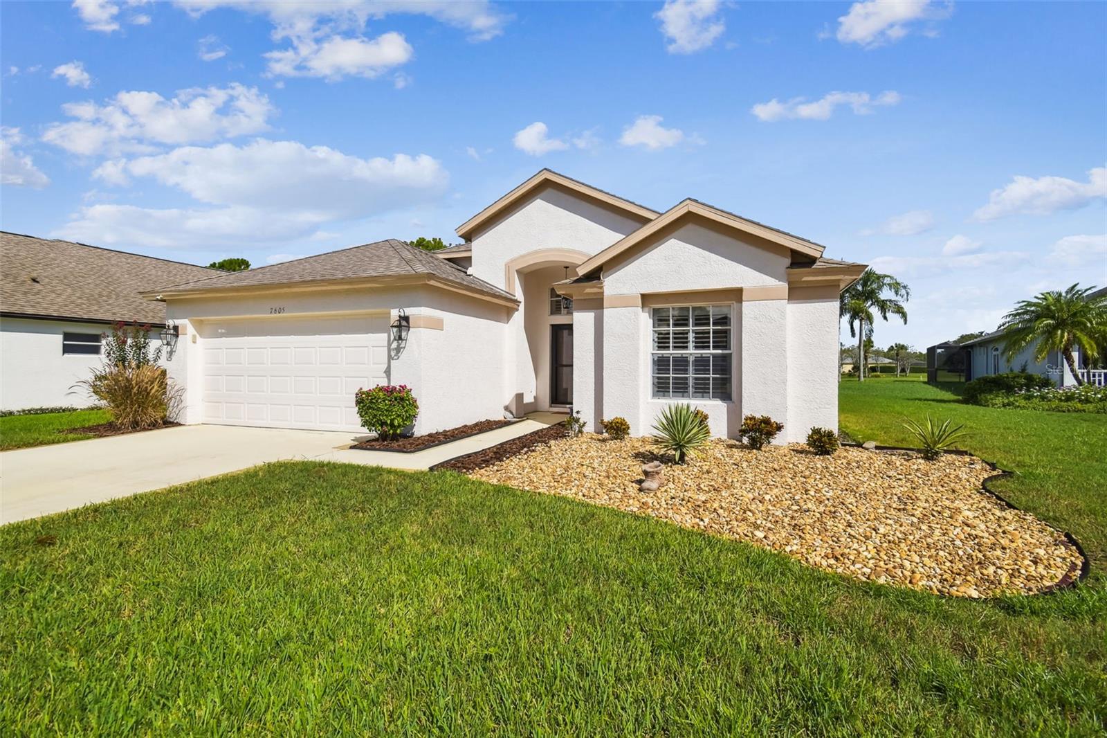 "WELCOME HOME". THIS 3 BEDROOM, 2 BATH HOME SITS ON THE 16th Fairway OF THE GROVES GOLF COURSE. The Groves is an Active Adult 18 Hole Golf Course Community. The extended screened lanai across the back of the house over looks open fairway and water view. Roof and outside paint were done in 2023. Water heater new in 2025. Rainbird Sprinkler system is new. Plantation Shutters on all windows including sliding glass door. The popular open floor plan offers a light and airy layout with combined living and dinning room. The well appointed kitchen offers new appliances, ample cabinets and Granite counter tops. The large Primary Suite boasts an updated en-suite bath with double sinks, granite counter tops a walk in shower and very large walk in closet. Inside laundry room with washer and dryer and cabinets. Garage has new flooring, over head storage and hurricane shutters. Right outside the gates is a Publix shopping center. The Groves offers Tennis Courts, Club house with restaurant, Library, workout room, craft room and Pro Shop. Shuffleboard and bocce courts.