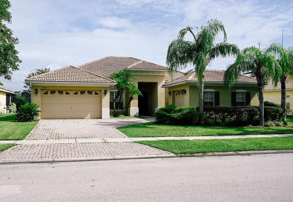 Welcome to 3504 Shorewood Drive in the stunning, guard-gated resort community of Bellalago—where resort-style living meets real-world opportunity! Listed at just $400,000, this spacious split floor plan offers 3 bedrooms, 3 full bathrooms, a bonus room perfect for an office or den, and a rare THREE-car garage. There’s no one directly in front or behind you, and a peaceful pond view awaits from the screened back patio (once the screens are replaced and it gets a deep clean!). Inside, you’ll find cherry cabinets, black stone countertops, crown molding throughout, and both the primary bedroom and Bedroom 2 feature private in-suite bathrooms—a rare and thoughtful layout for guests or multi-gen living. Now, let’s talk about the “opportunity”: the roof has seen better days, and the resulting water damage is mostly visible in the office area and a few other spots. There’s also some flooring damage in the primary bedroom due to water intrusion. The back patio needs some TLC, and the home is being sold without appliances—but that’s your chance to truly make it your own. With recent sales in Bellalago ranging from $490,000 to $560,000, this price is an absolute bargain for anyone ready to roll up their sleeves and build some instant equity. The community features access to Lake Toho, a private boat ramp, fishing pier, boardwalk, full-service restaurant, splash pad, water slides, volleyball courts, playgrounds, and not one but two fitness centers offering yoga and dance classes. Kids attend Bellalago Academy (K–8) and Liberty High School. With 24-hour security and a lifestyle that feels like a year-round vacation, this home is your chance to get into something special—at a price that leaves room for upgrades and personal touches. Bring your vision and your flip-flops… because the Florida lifestyle is calling!