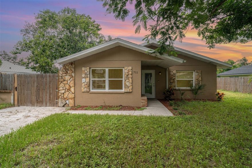 One or more photo(s) has been virtually staged. Welcome to this beautifully updated 4-bedroom, 2-bathroom home nestled in the heart of Bradenton. With fresh interior finishes, a spacious open floor plan, and abundant natural light, this home offers modern comfort with a touch of charm. The kitchen features crisp cabinetry, stainless steel appliances, and solid-surface countertops — perfect for cooking and entertaining. The generously sized living area flows seamlessly into the dining space for ample space. The primary suite boasts a private ensuite bathroom and sliding doors that lead outside. Three additional bedrooms ensuring flexibility for guests or a home office. Enjoy relaxing evenings or weekend BBQs in the fully fenced backyard, complete with mature landscaping, a large patio, and a charming brick fireplace. Located just minutes from shopping, dining, parks, and the beautiful Gulf Coast beaches, this move-in-ready gem is one you don’t want to miss!