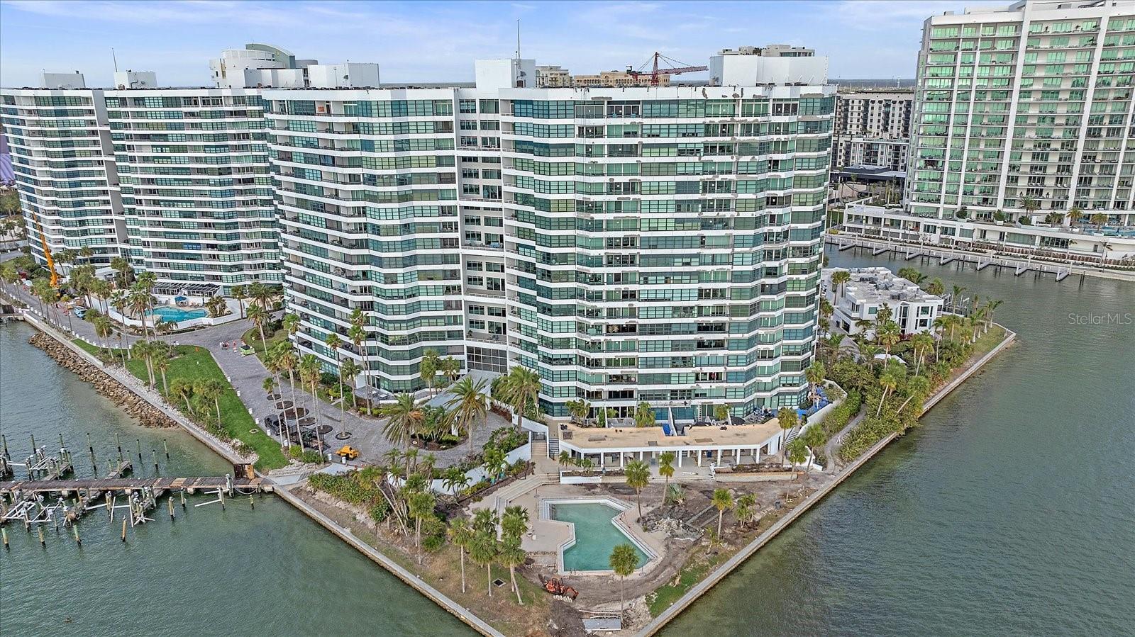 **Exquisite End Unit Condo on the 10th floor with Panoramic Bay Views in Sarasota** Discover the epitome of luxurious living in this stunning corner condo conveniently located in Condo on the Bay, a highly sought after community offering unparalleled lifestyle benefits, including the most spectacular bayfront pools in Sarasota. This beautifully designed 2-bedroom, 2-bathroom residence offers breathtaking panoramic views of Sarasota Bay and the surrounding cityscape. Steps away from Sarasota's award winning new park, The Bay. Enjoy more than 53 acres of park land that includes mangrove walkways, public gardens, a concert stage, children's play area, an event center and much more. Step inside to find an open floor plan enhanced by elegant crown molding and abundant natural light with views of the water from every room! The spacious living area seamlessly connects to a gourmet kitchen featuring stainless steel appliances, granite countertops, and solid wood cabinets. Designed to host and enjoy spectacular sunset views with family and friends, especially from the private terrace off the main living area. Inspired by Cezanne, this model was designed to showcase the sweeping views of nature's canvas and includes ample wall space for your own personal gallery. A generously sized primary suite including a private terrace, walk-in closet, built in closet for additional storage, dual sinks and a spacious, spa-like shower. The versatile guest suite features 2 built-in twin Murphy beds and a walk-in closet, perfect for accommodating guests or serving as a stylish home office. As a resident, you'll enjoy exceptional amenities including a 24/7 security gatehouse, two tennis/pickleball courts, concierge service, a fishing pier, two fitness rooms, kayak/jet ski storage, boat docking on a first come basis, electric car charging station and a social gathering room with a library and kitchen. Residents of both towers get together for trivia nights, walking/biking, exercise classes and more creating a lively atmosphere! To top it all off, this elegant condo is walking distance to Downtown Sarasota which hosts an array of fine dining options, boutiques, theaters, the Van Wezel, cultural events, farmer's market and much more! A short drive to internationally known beaches such as Lido Key and Siesta Key Beach, the #1 beach in the Country and #4 in the World. Don’t miss the chance to rent or own this premier residence in one of Sarasota’s most desirable locations!