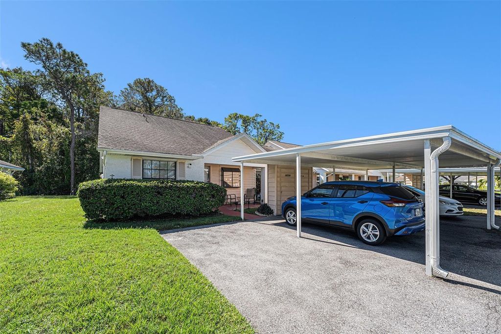 Photo of 10736 Laquinta Drive, New Port Richey, FL 34654 (MLS # TB8472806)