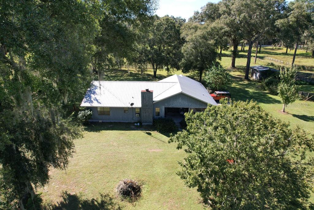One or more photo(s) has been virtually staged. Beautiful property located minutes from Equestrian Center, to be precise property is across from Shalom Park. This property has many possibilities, can be developed or just upgrade what is already here. Home features 3-bedroom 2 bath, 2 car garage that was enclosed but can be re-opened for proper use. Wood burning fireplace with brick. Home also has an open front porch that lets you contemplate the beautiful nature. barn with stalls incorporated for feeding and stabling field horses. This property is divided into multiple fields and is laid out to handle many horses. , a washroom, feed room, tack room and barn office, two more buildings for equipment storage. Property is surrounded by two big developments. that mean that this can be also. close to all of the showgrounds, and located within a short drive to all amenities for shopping, groceries, and farm goods. ,