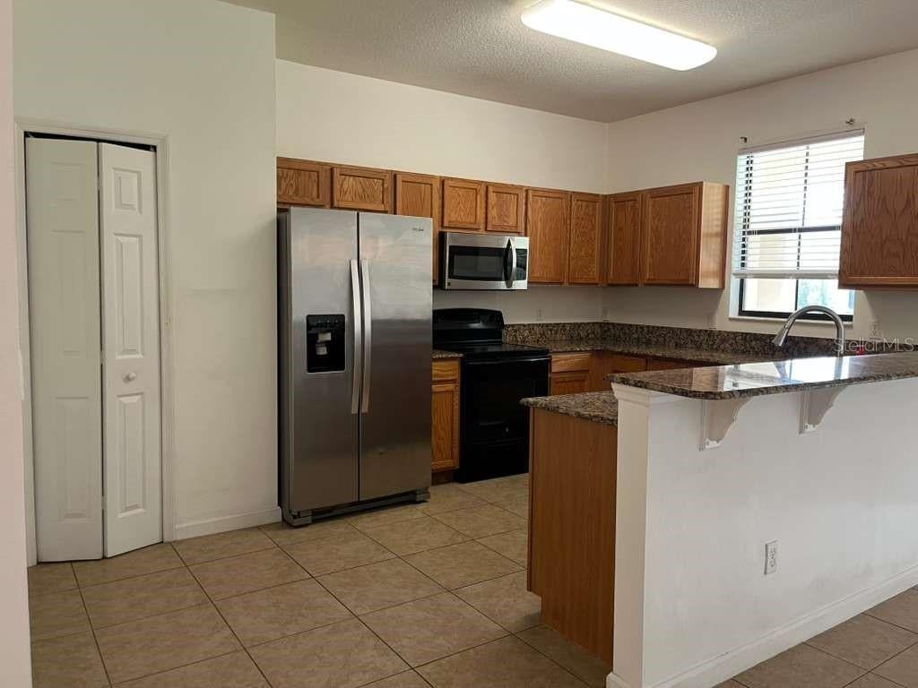 Photo of 1712 Portofino Meadows Boulevard, Orlando, FL 32824 (MLS # S5156784)