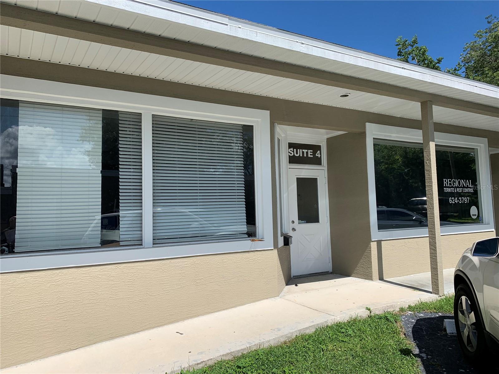 Unit 4 - 525sf, $950/month Gross Rent. Retail space. Open interior formerly used as a Barber Shop, with plumbing drain and water supply lines for a service sink, and 1 bathroom. Through the wall A/C both front and back. Not on same floor level as Unit 3.